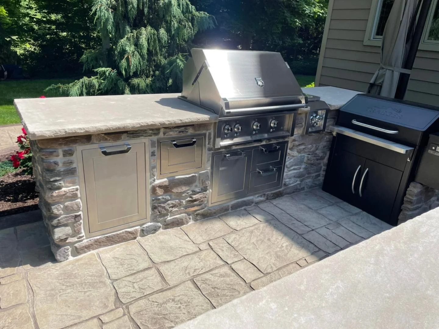 A Landscape Design With an Outdoor Kitchen Is Outdoor Living at Its Finest in the Brecksville, OH Area