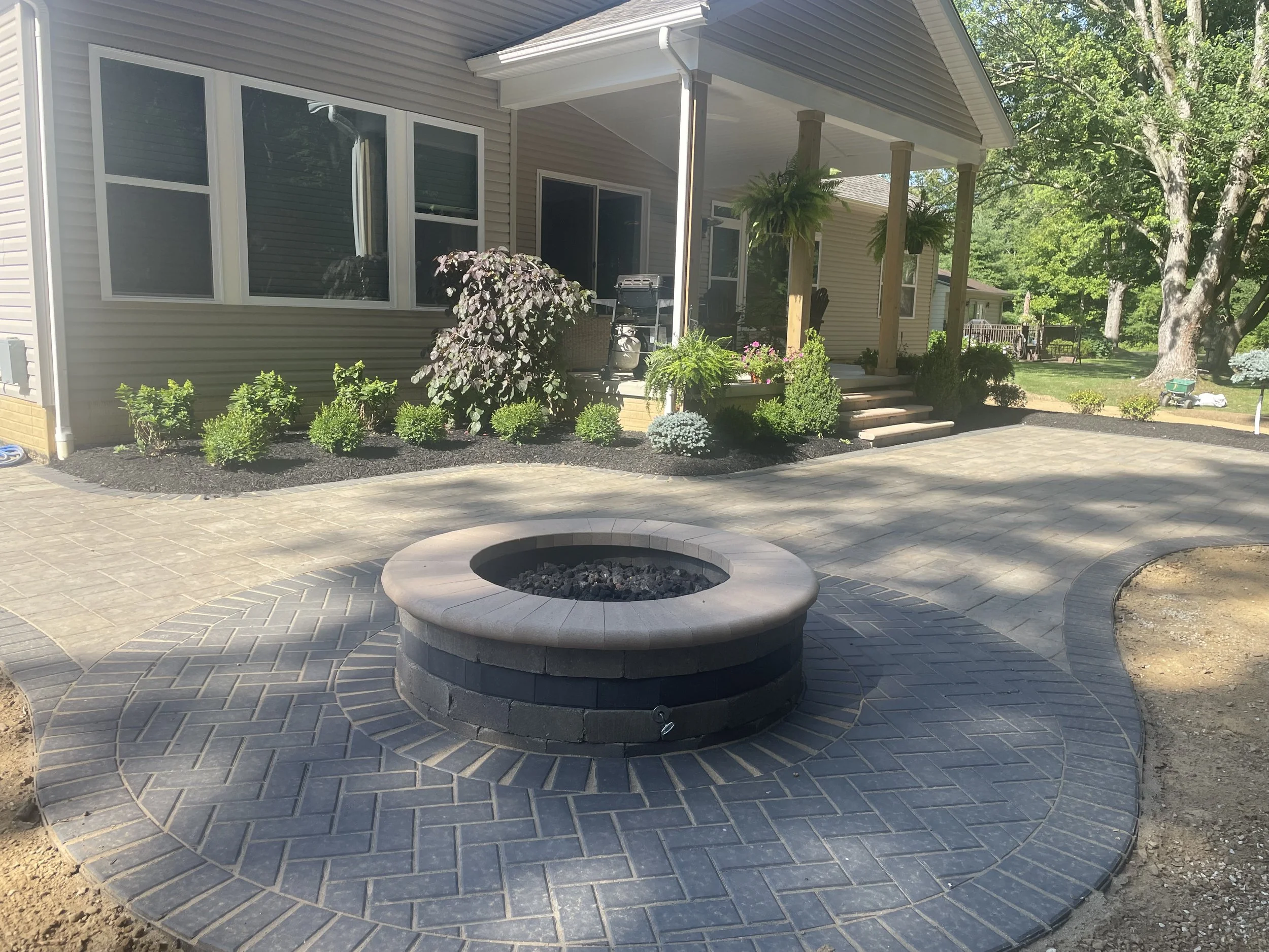 Transform Your Medina, OH Backyard: 5 Ways a Landscaping Company Creates a Cozy Bonfire Gathering Spot