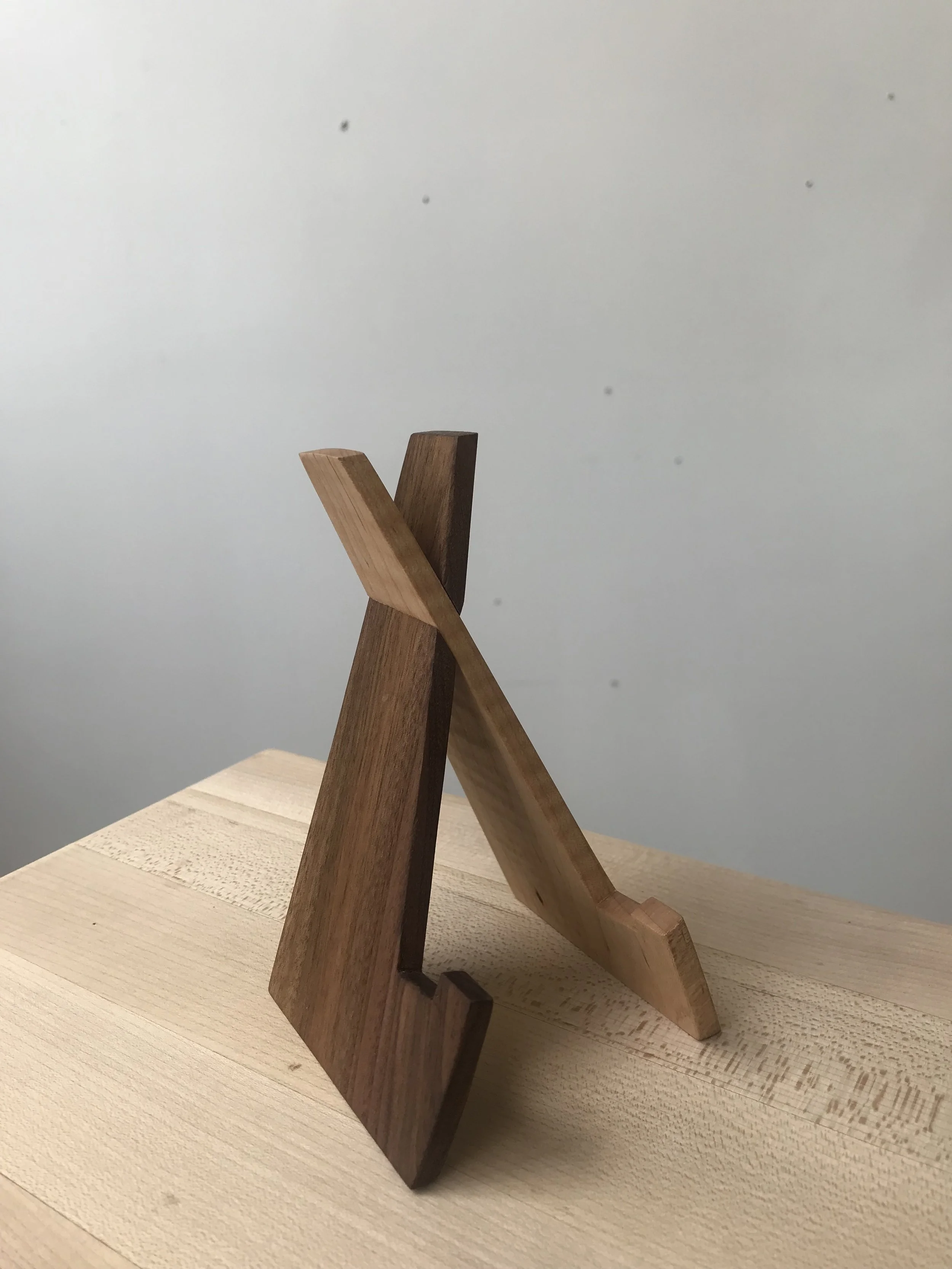   Maple, walnut.  A more dignified solution to propping your phone up against other objects. The easel is collapsible to take it anywhere. 