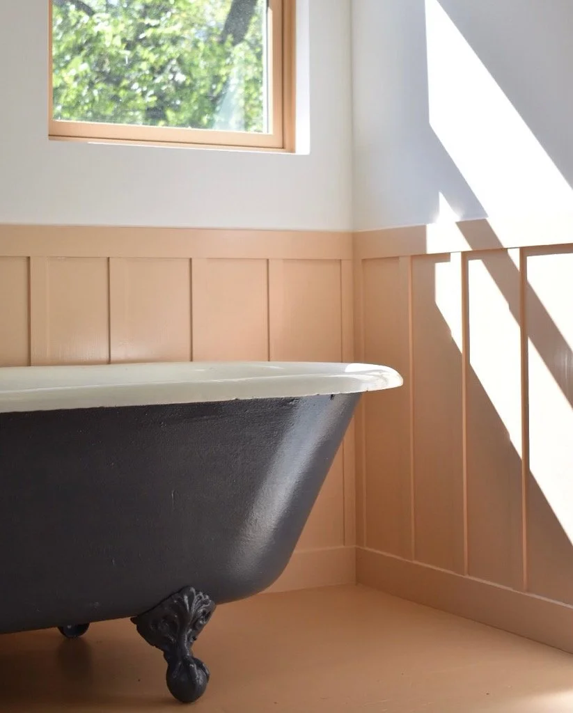  Antique cast-iron tub, Standard Sanitary Co., 1906. Maple wall panelling, existing wood floor. 