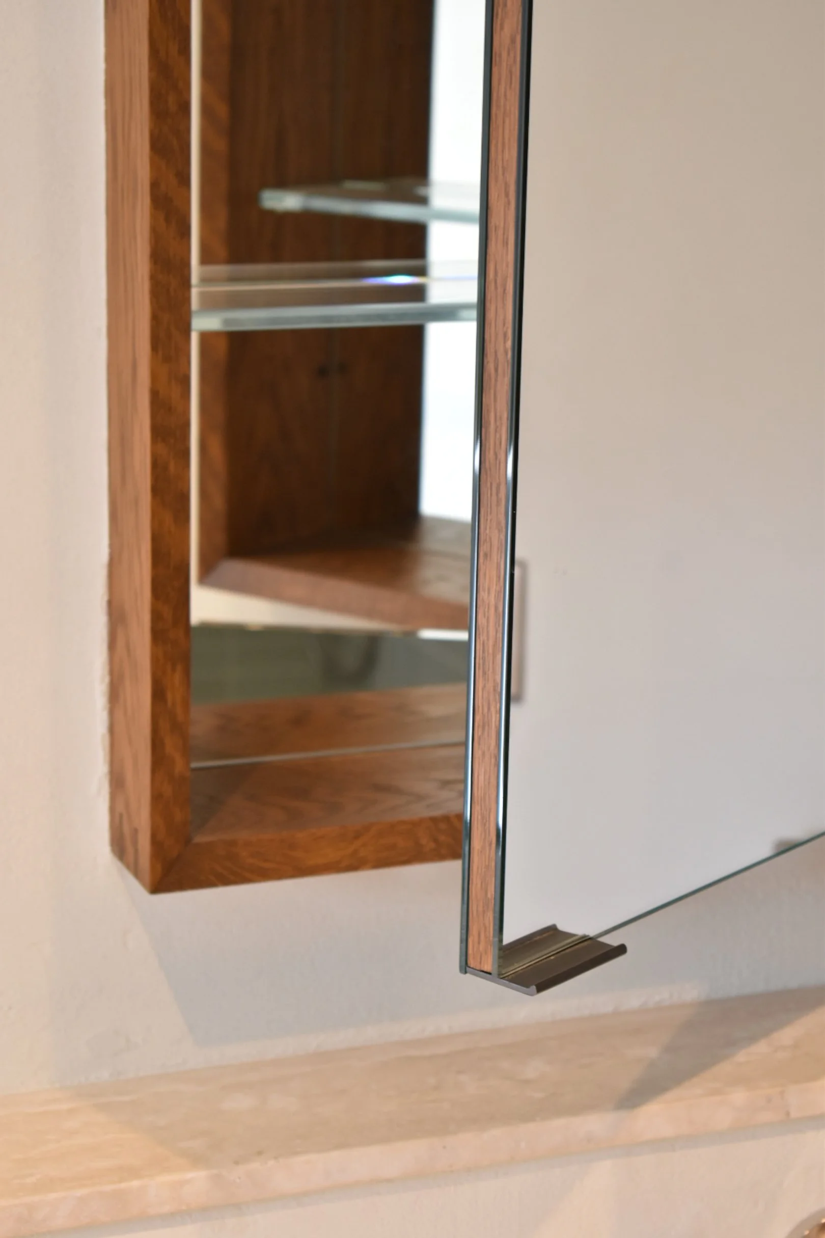  Pivot doors are mirrored front and back. The mirrors are laminated to a white oak banded core. 