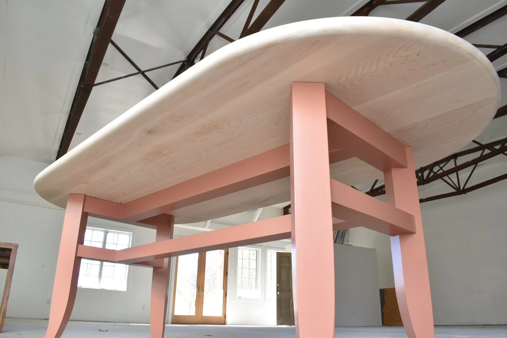  Tabletop is attached with low-profile figure-8 washers to allow for wood movement and keep the undercarriage tidy and touchable.  