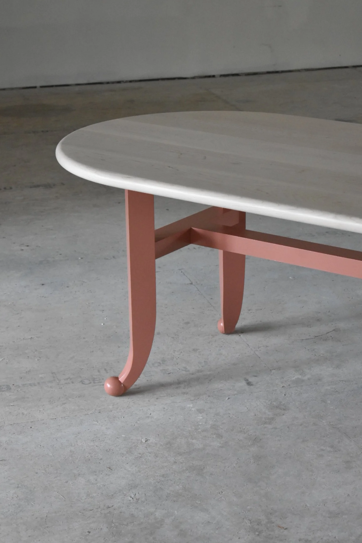  Solid Maple construction; bleached top with bullnose edge; hand-brushed base in Porphyry Pink.  