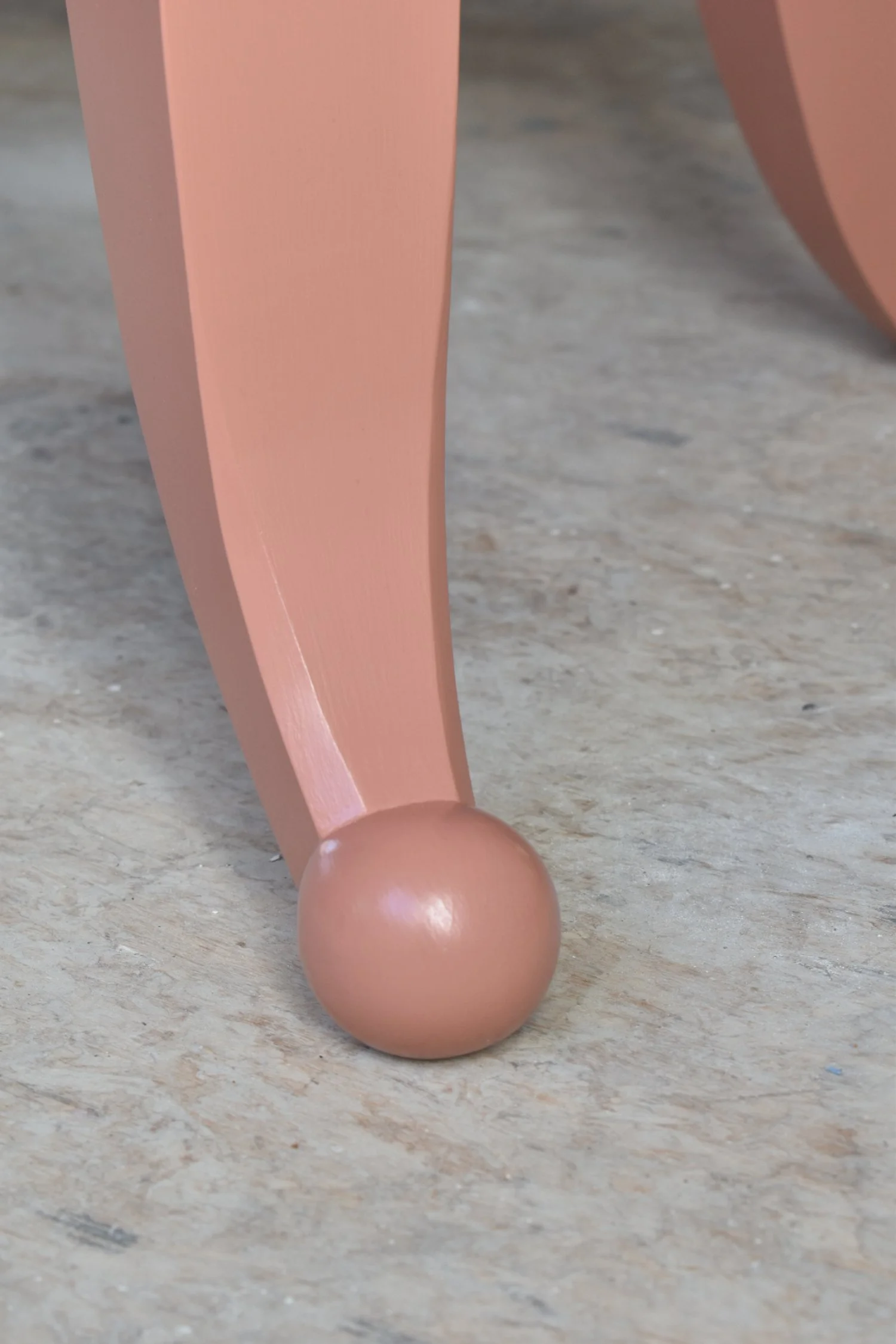  Shaped legs end in a hand-carved ball. 