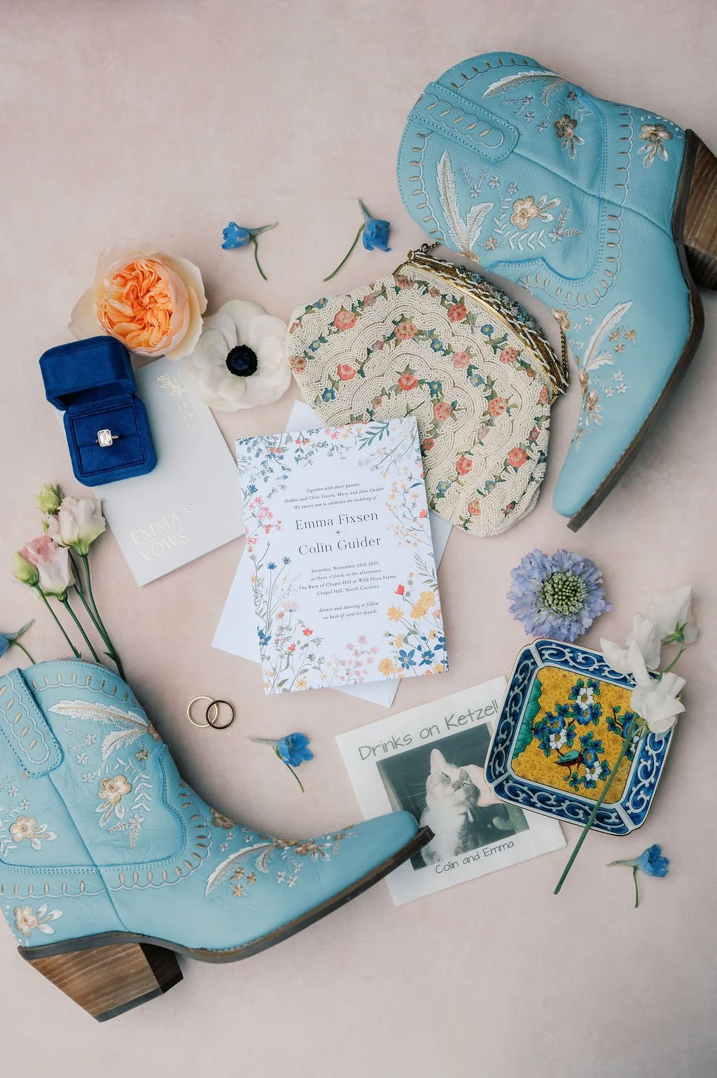 Wedding invitation suite, rings, and turquoise embroidered boots photographed for a wedding at The Barn of Chapel Hill in North Carolina