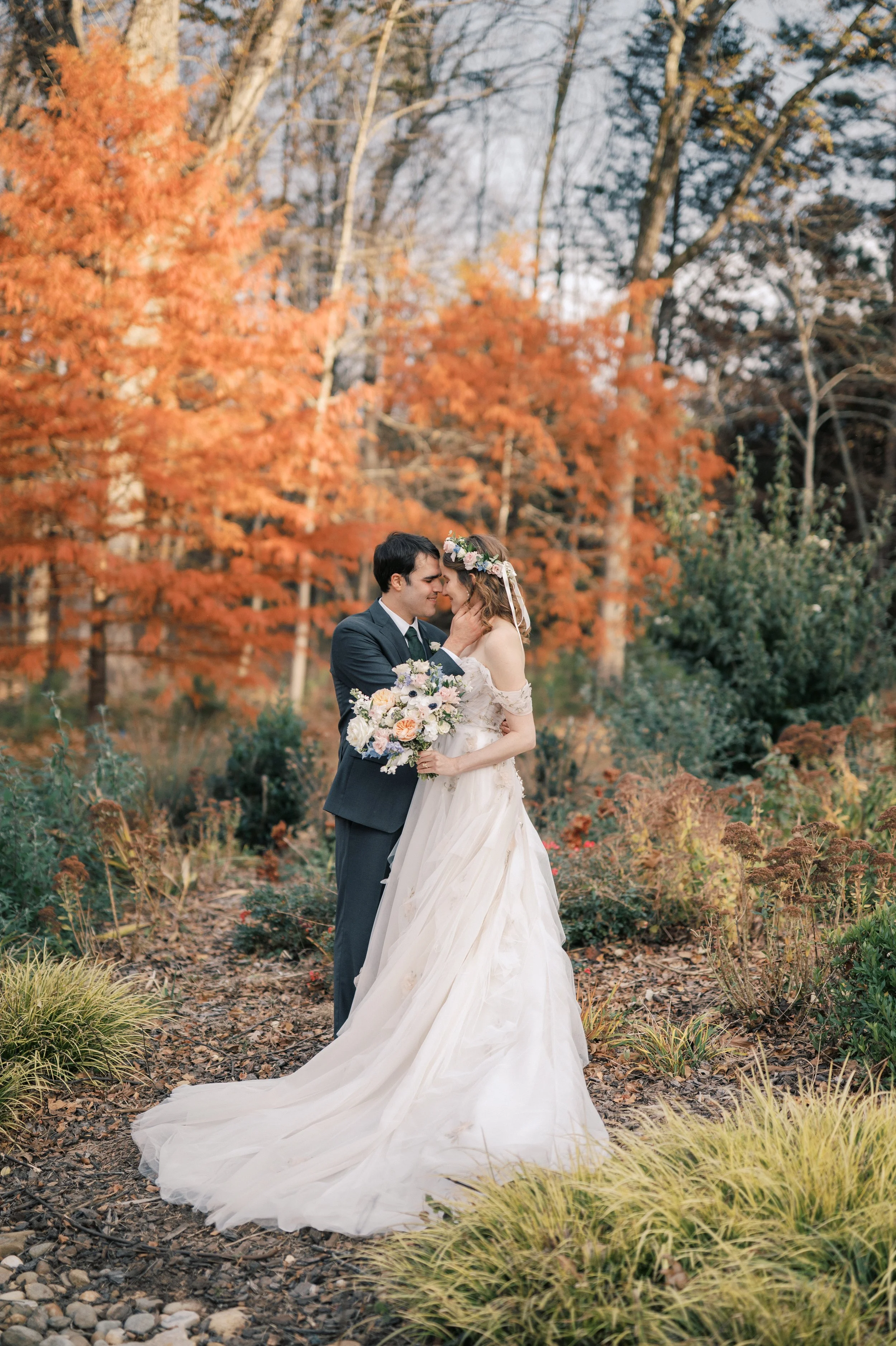 Bride and groom portraits in fall foliage at The Barn of Chapel Hill garden wedding venue in North Carolina.
