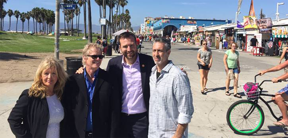 Members of the Venice Chamber of Commerce with California Senator Ben Allen on the Ocean Front Walk Boardwalk after a chamber meet Wednesday. From left to right are Sandy West, board member, Carl Lambert, chamber president, California Senator Ben Allen, and George Francisco, chamber vice president. California Senator Ben Allen spoke to members of the Venice Chamber of Commerce Wednesday at Danny’s Restaurant and said that everything in Venice is sacred and of vast historical significance … even the manhole covers that say “Made in China.” Most say India.