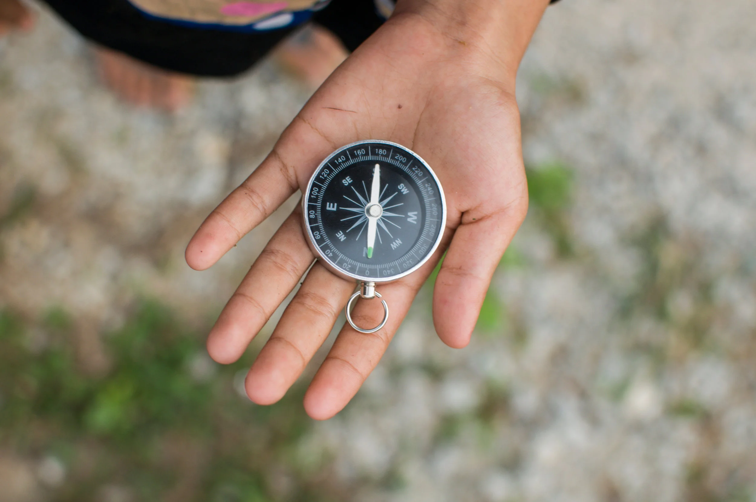 hand holding a compass.jpg