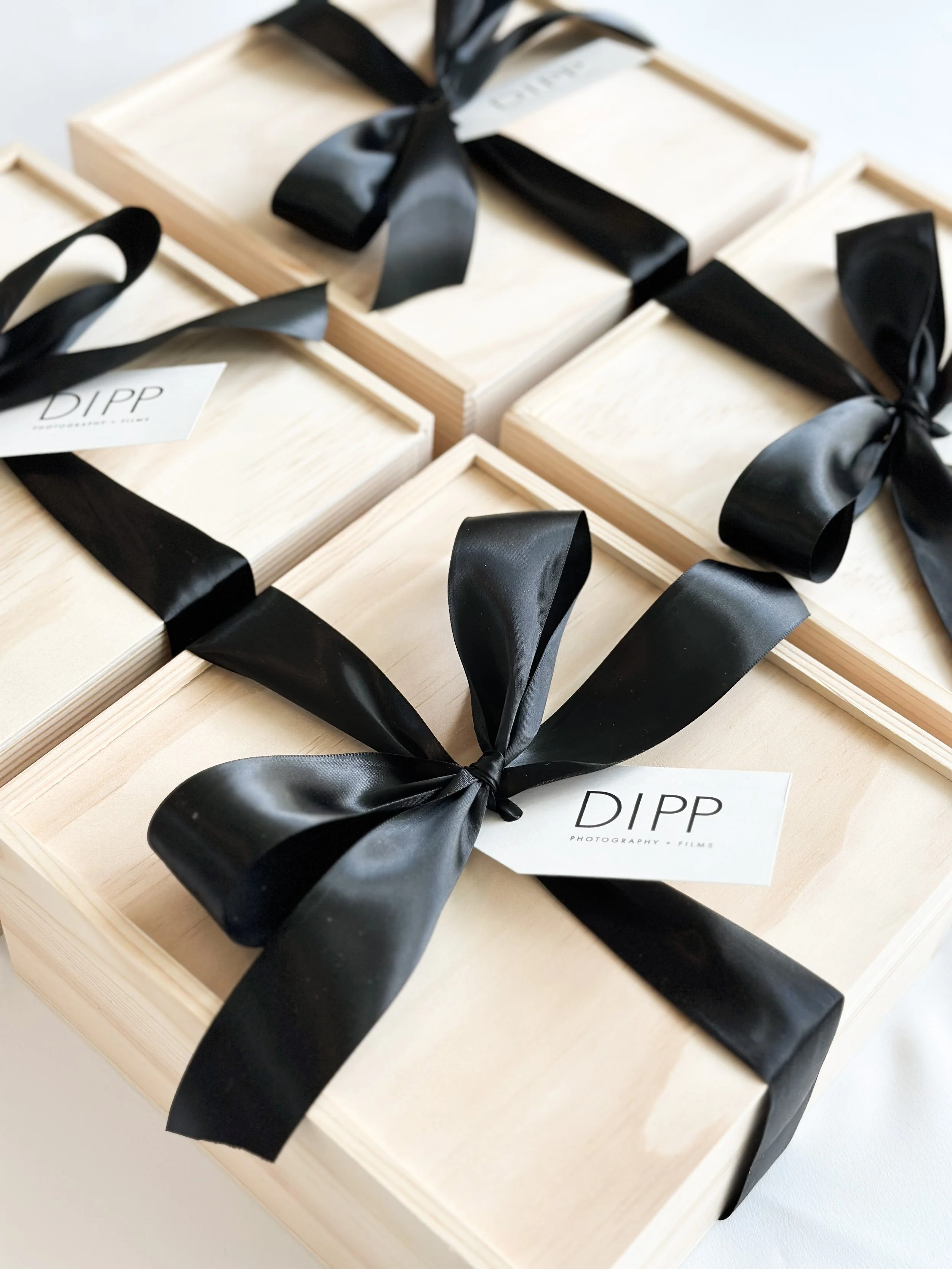 Luxury custom corporate gift boxes with branded packaging and ribbon