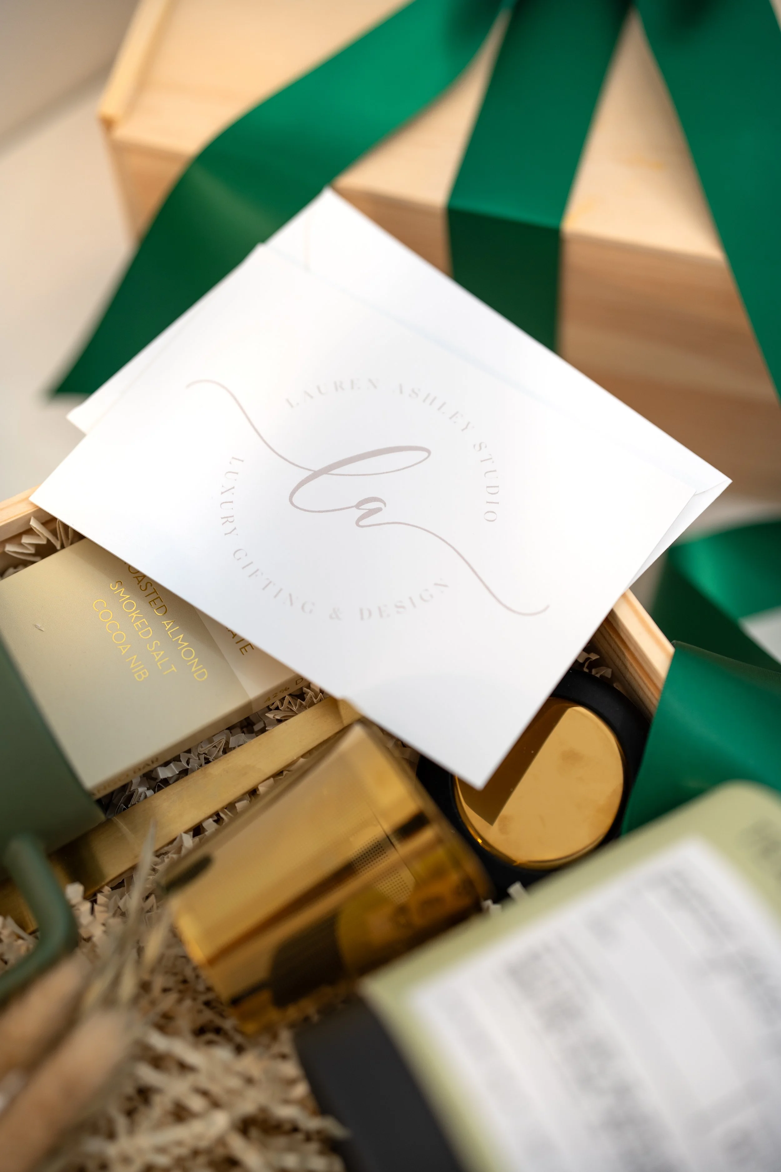 Lauren Ashley Studio branded card inside a luxury holiday gift box