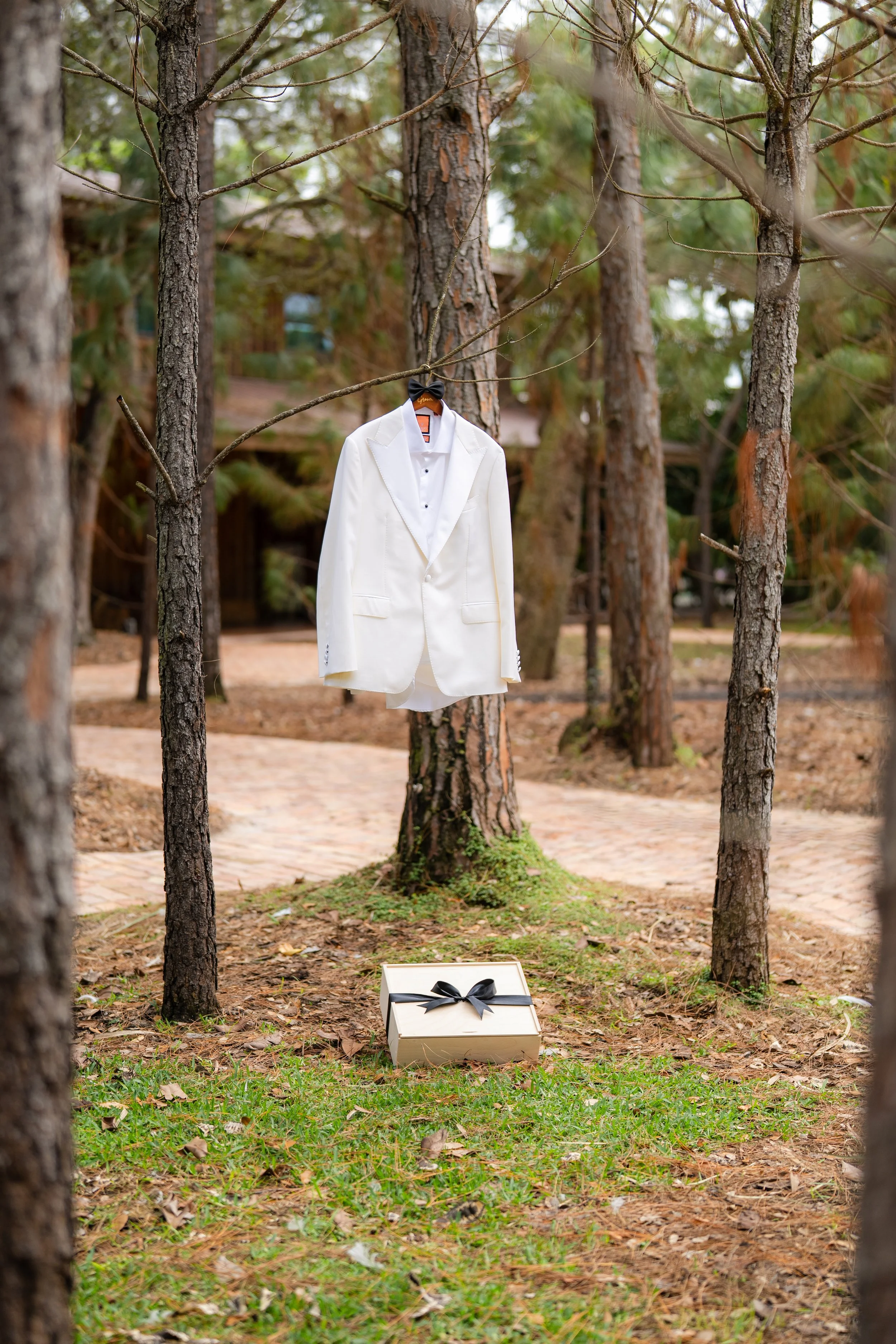 Luxury groom gift box in Miami styled with groom jacket before wedding ceremony