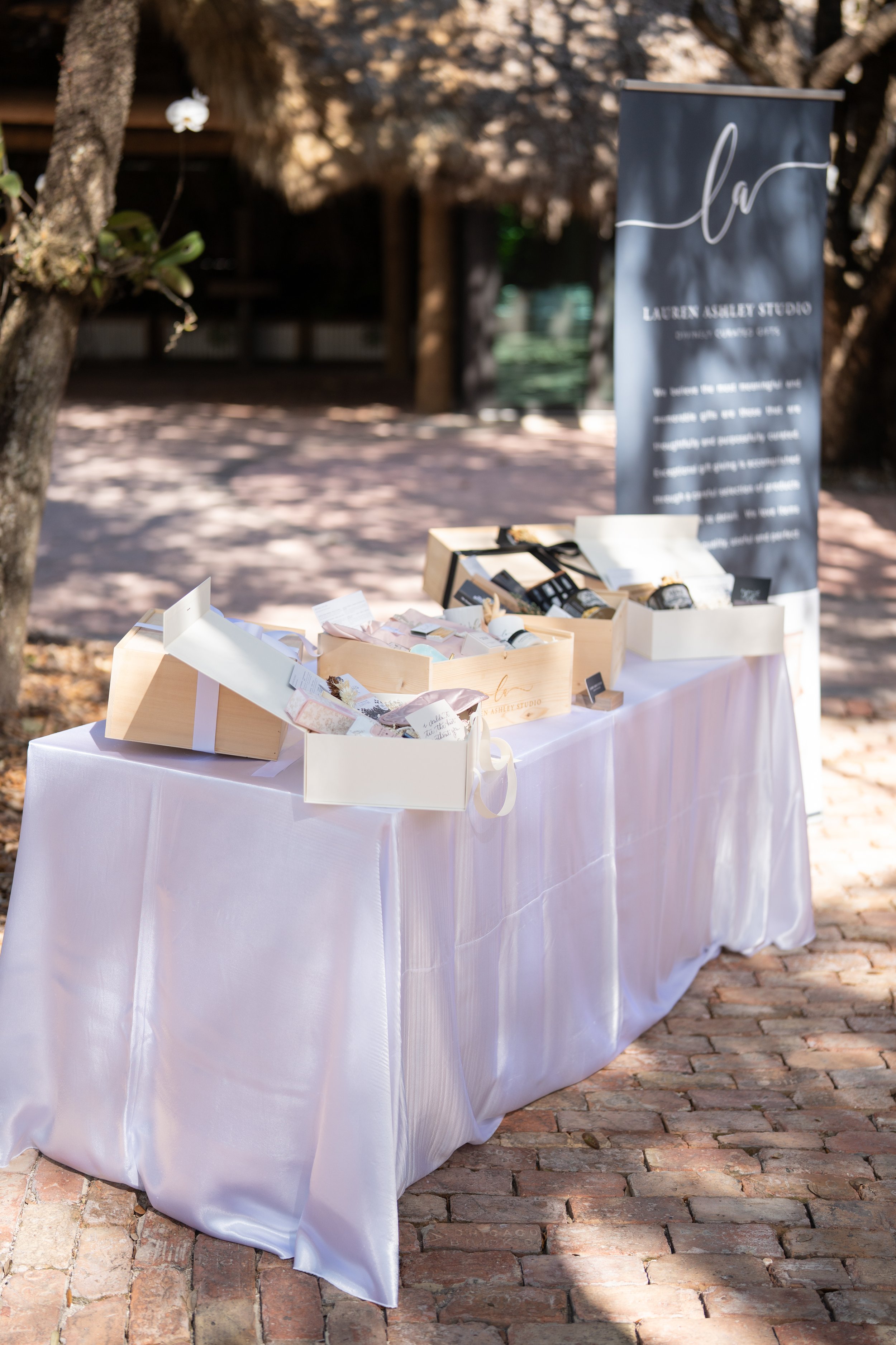 Wedding welcome gift boxes display at The Barn 305 showcase in Miami