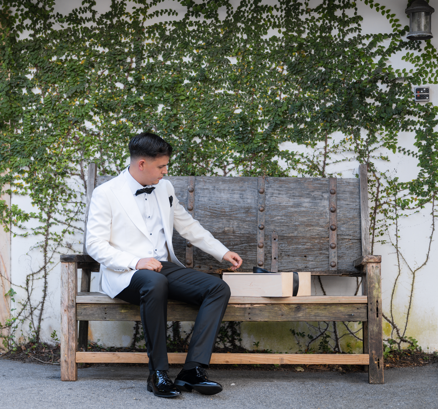 Groom holding luxury wedding gift box in Miami before ceremony