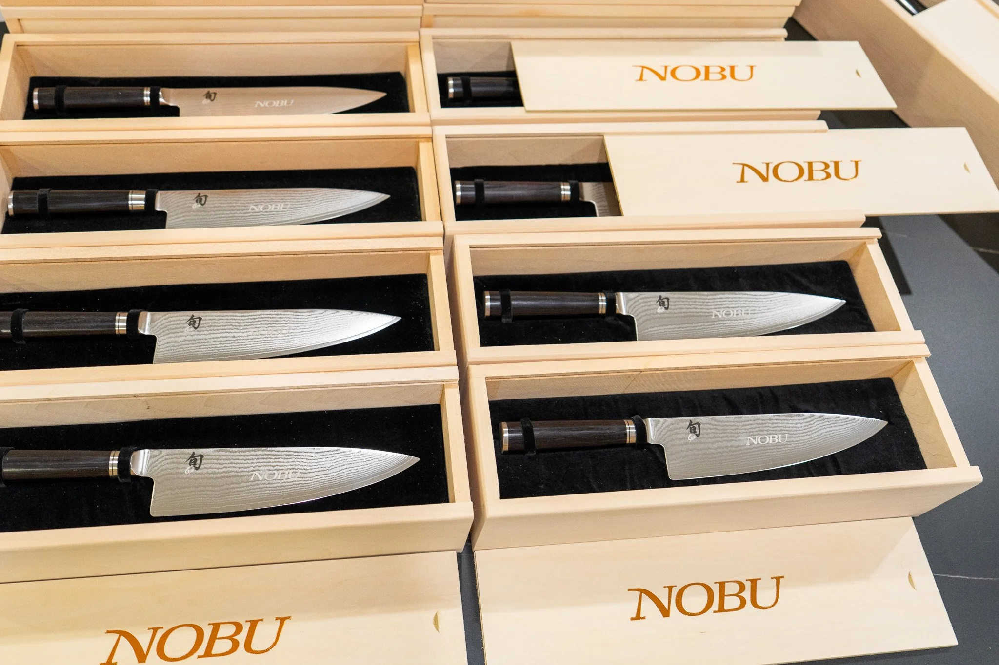 Custom branded wooden gift boxes in Miami with engraved Nobu presentation boxes