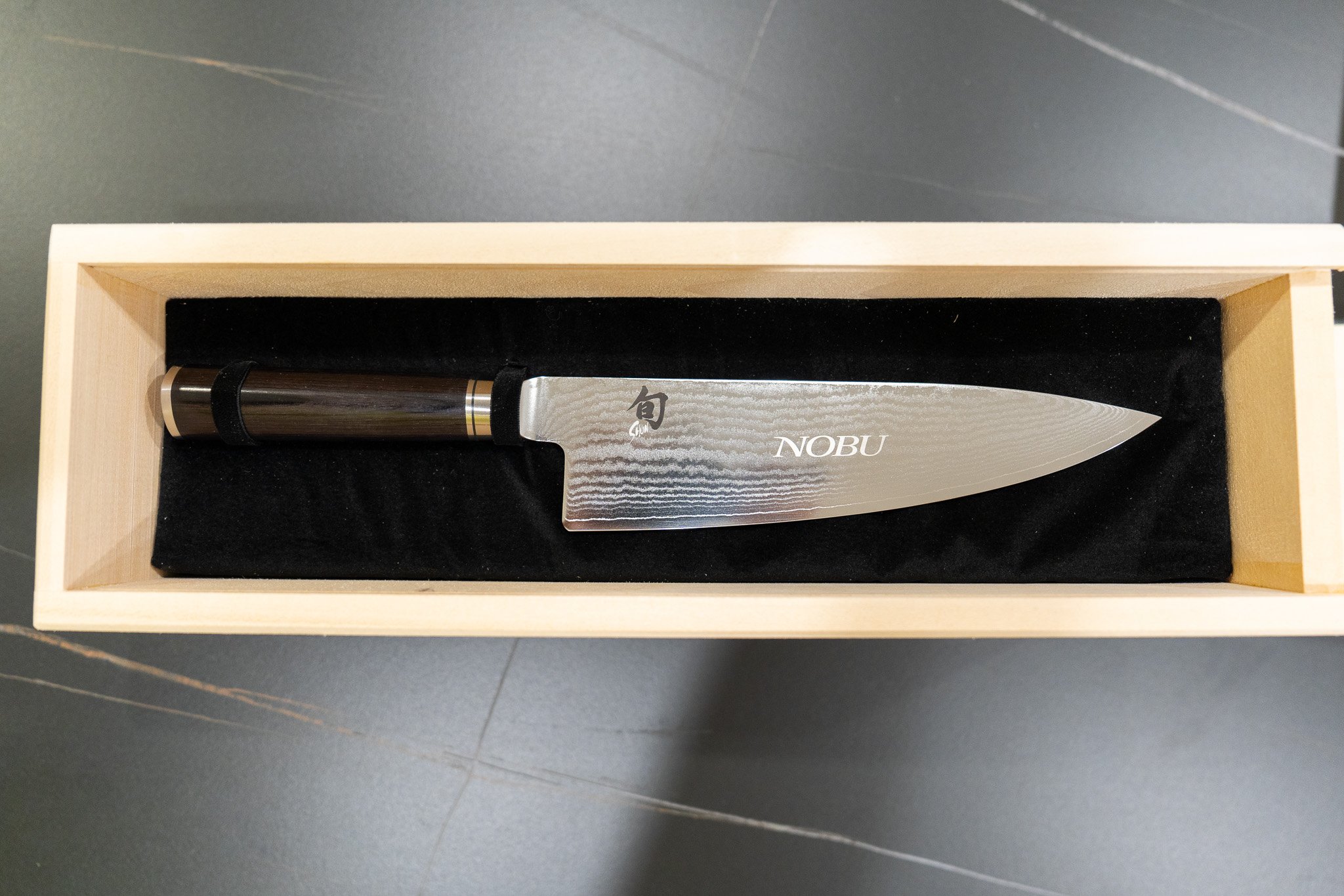 Premium wooden gift box in Miami with engraved Nobu logo and luxury knife presentation