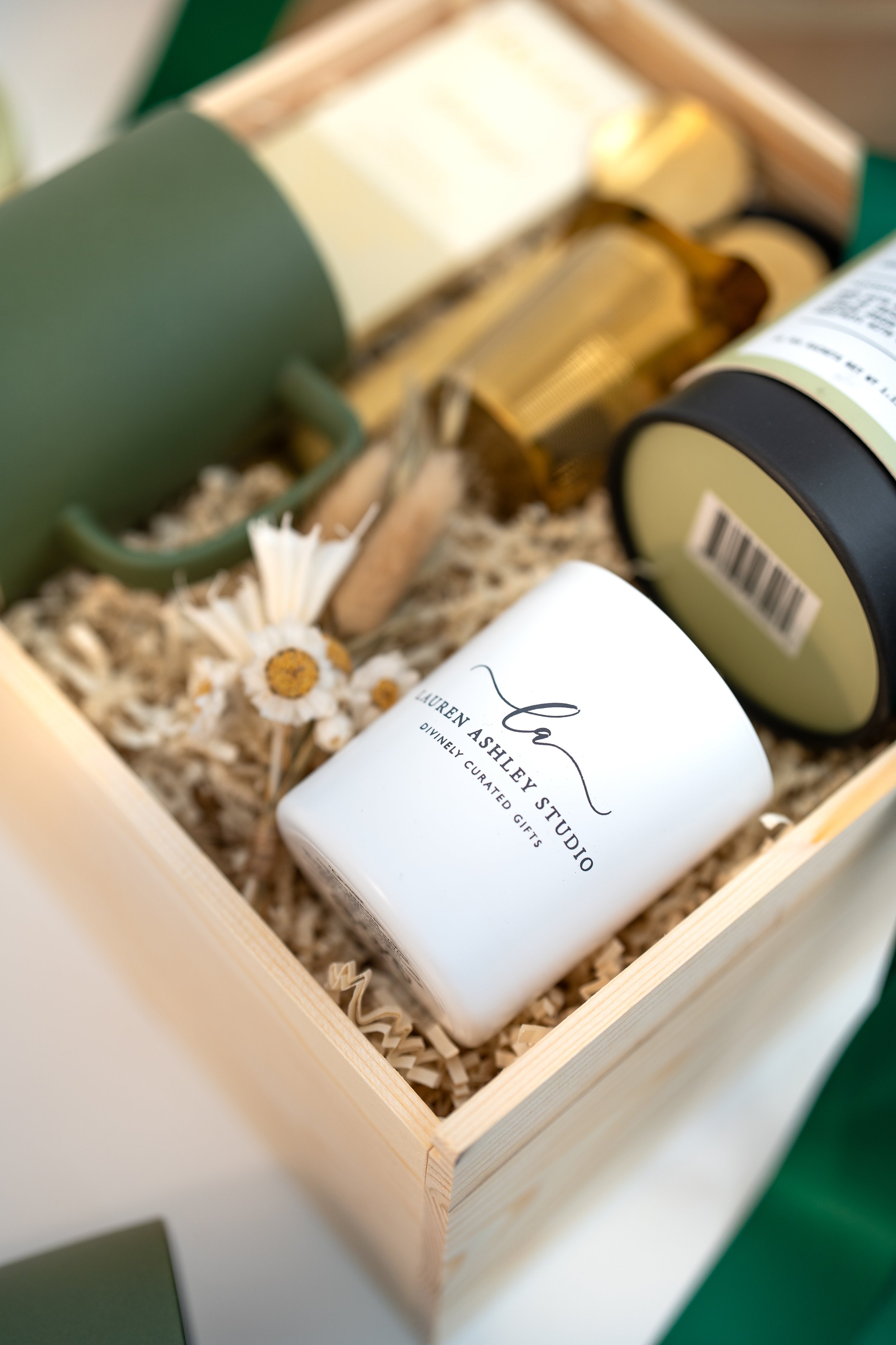 Branded candle inside a Lauren Ashley Studio holiday gift box