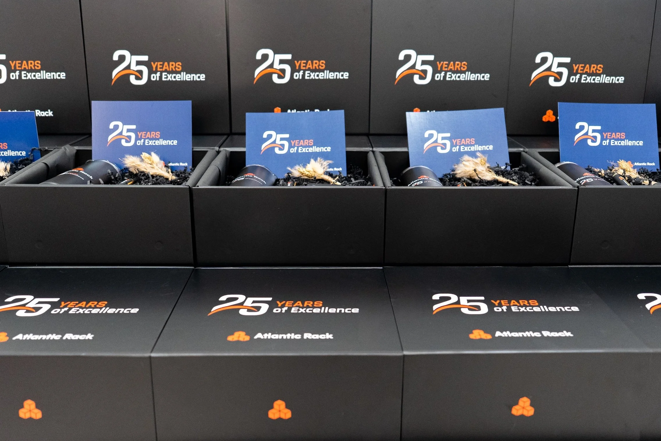 Corporate gifting experience in Miami with multiple Atlantic Rack 25 year anniversary gift boxes