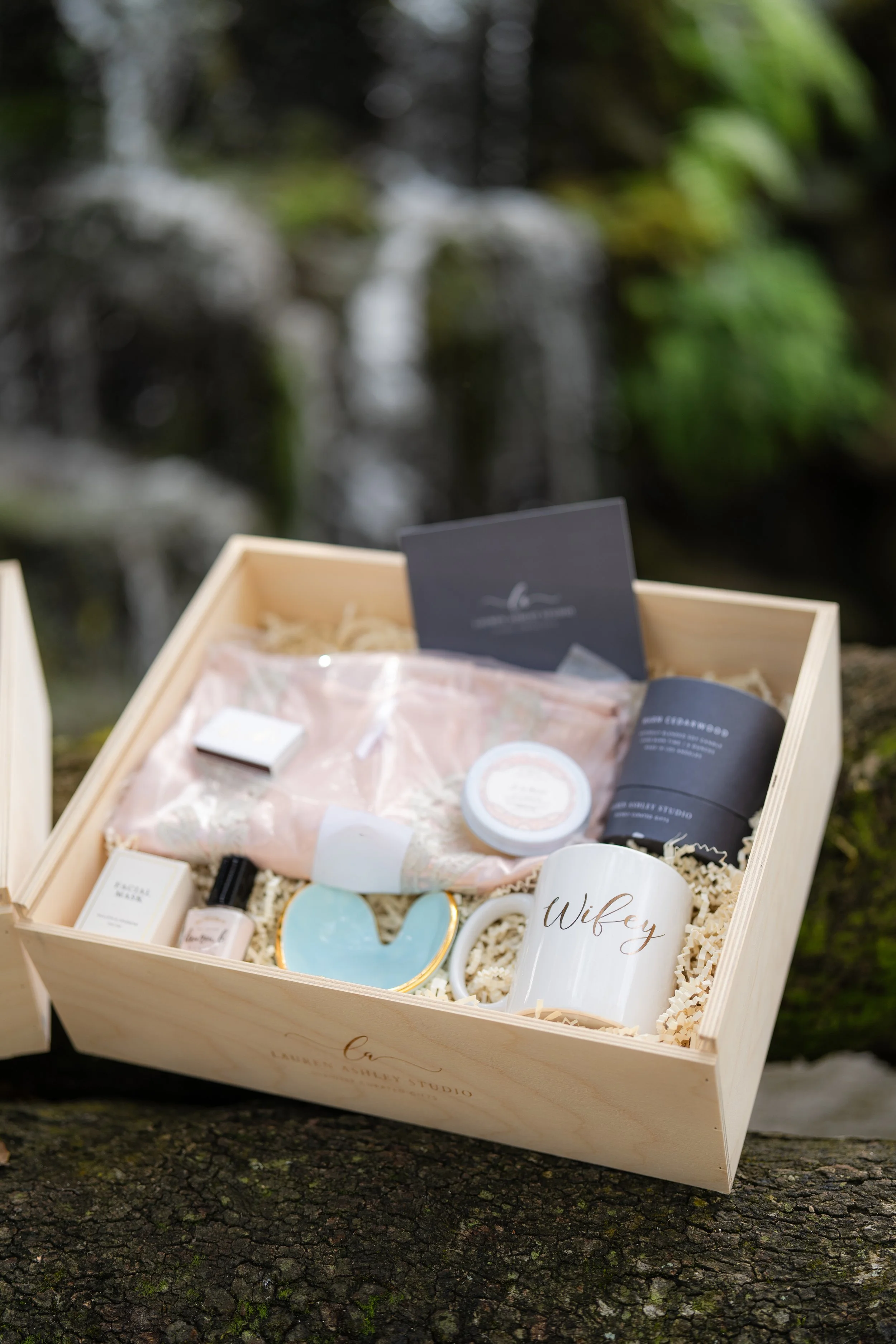 Luxury bride gift box in Miami styled outdoors with waterfall backdrop