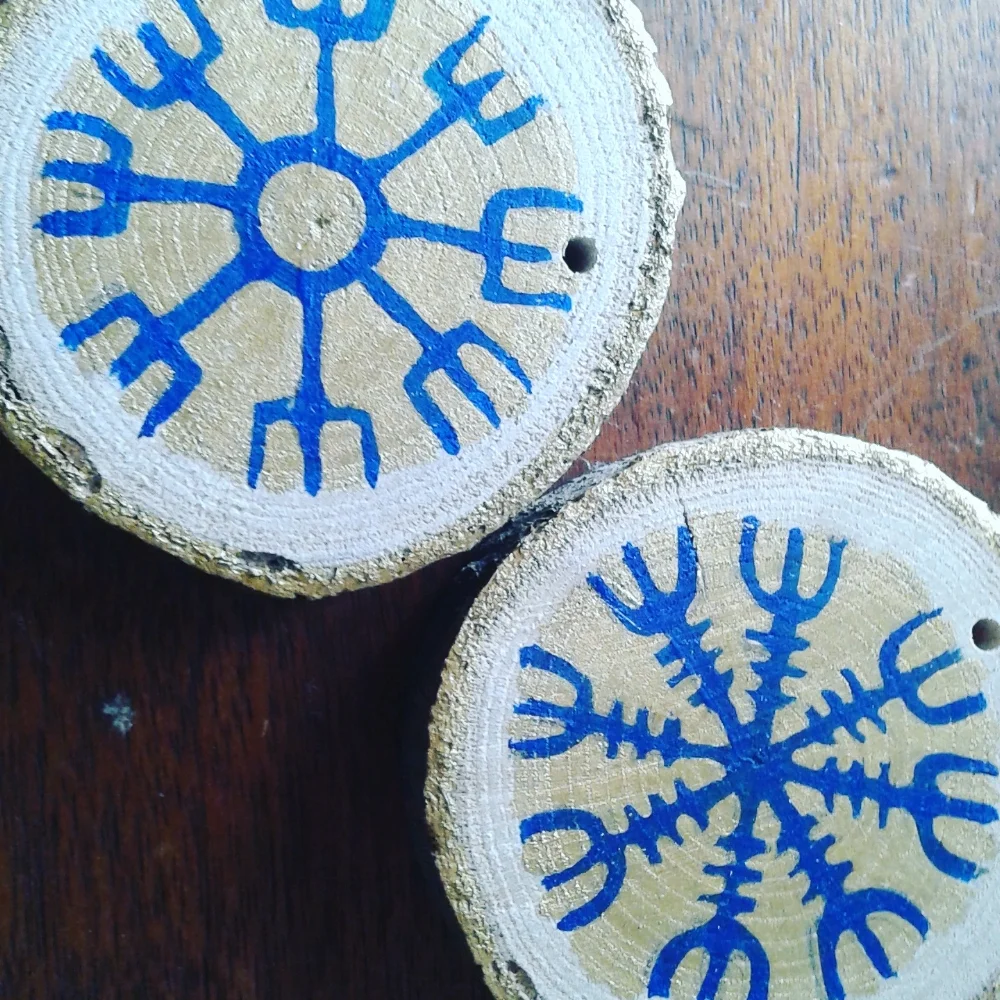 A variety of staves applied to wooden discs as decorative ornaments.