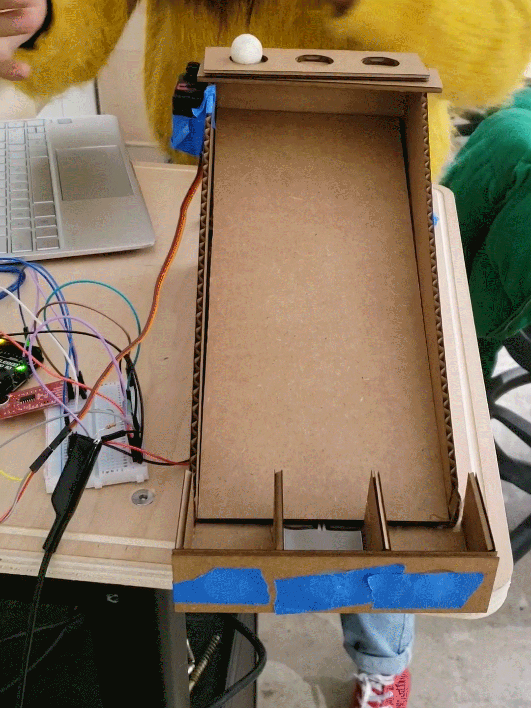 (ME!) Playing with the sound sensor that triggers motor movement and FSR pressure triggering the LED light on the breadboard