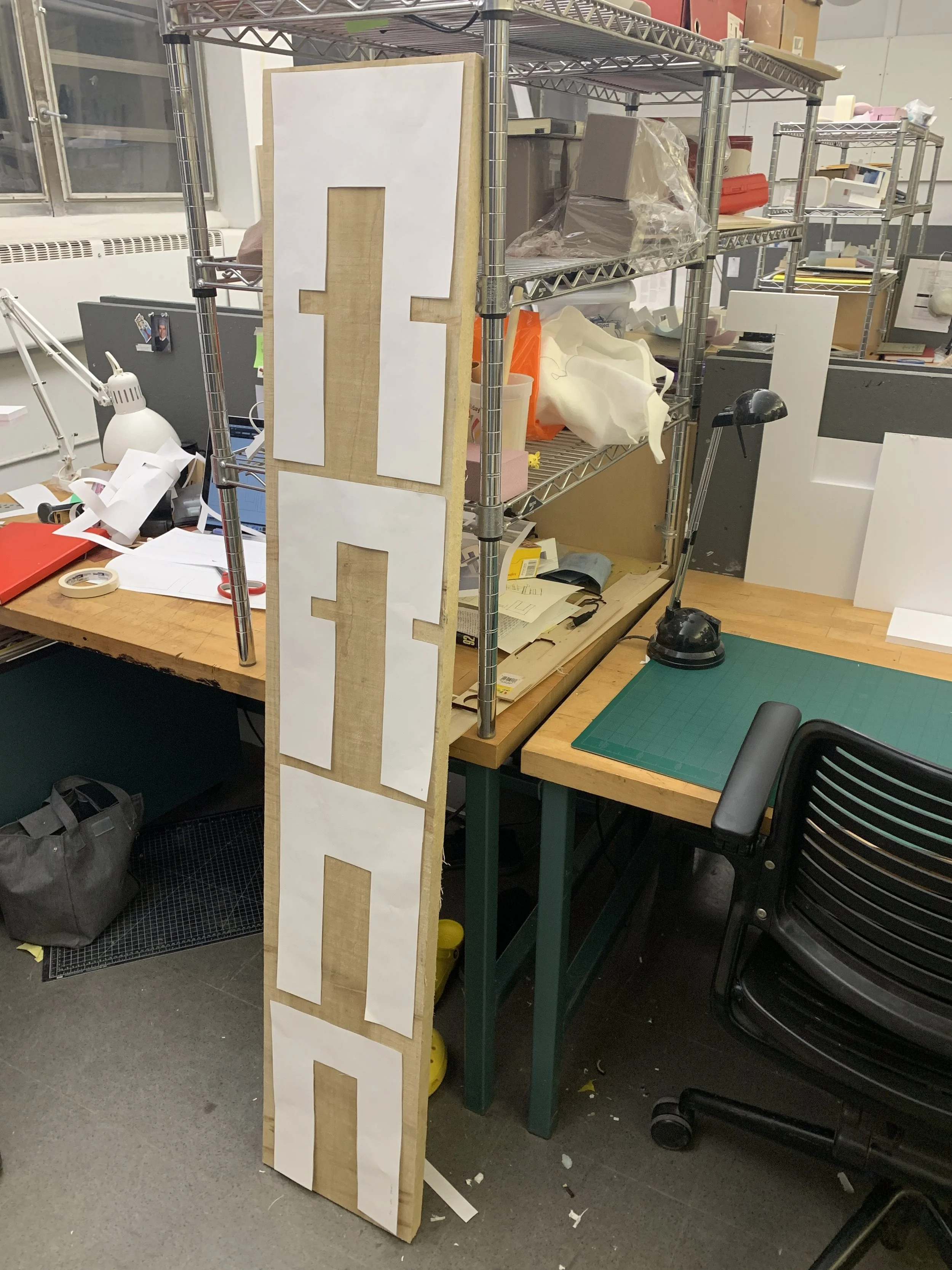 Four pieces of Geoform book table laid out on the board