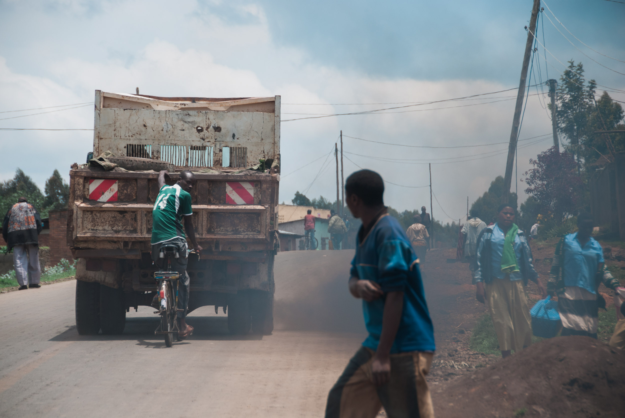  Many cyclists in Rwanda catch rides from passing trucks up the country's steep highways. 