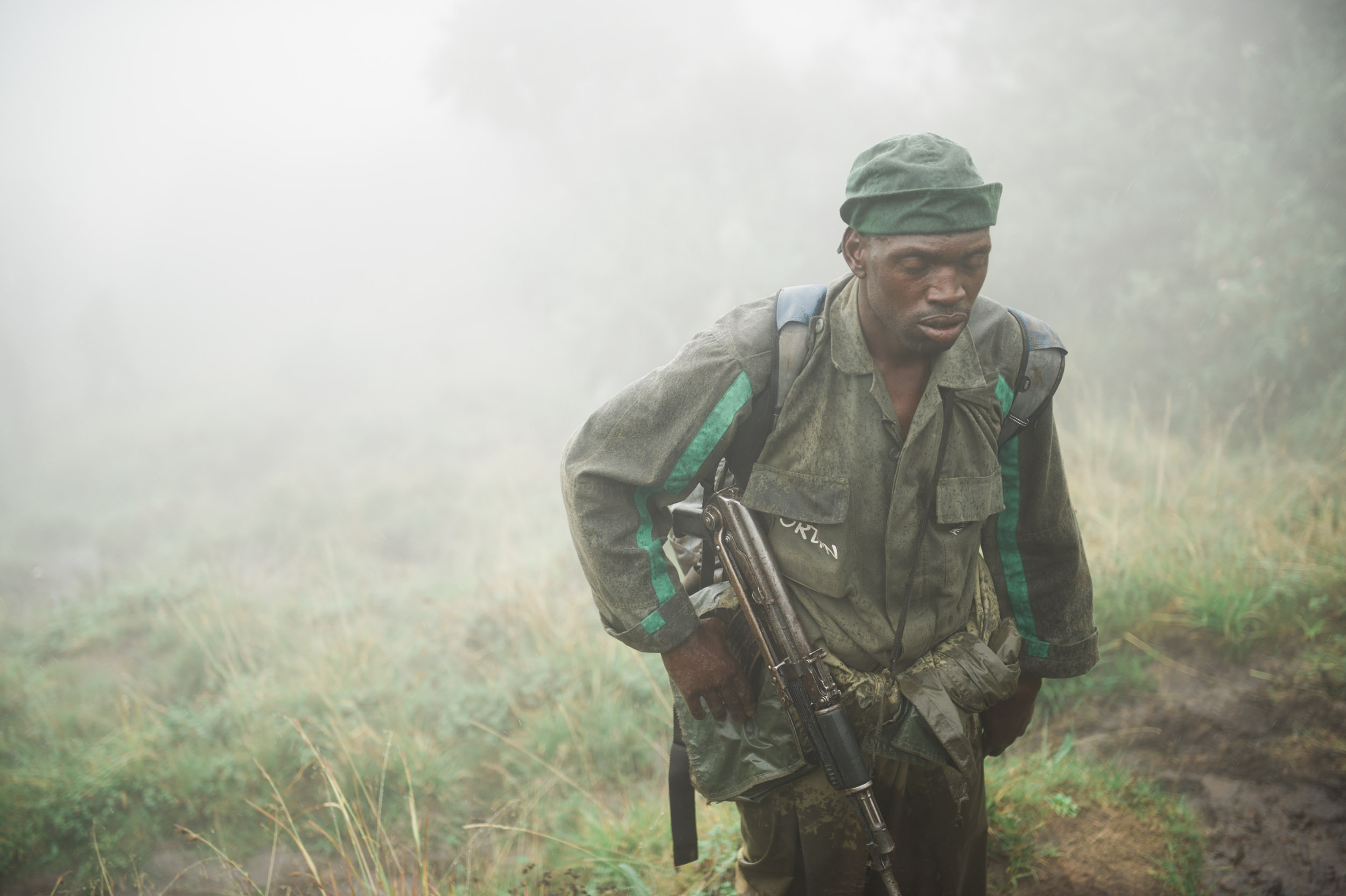  A Volcanoes National Park ranger escorts our group of expats up the 12,000 foot volcano Mt. Bisoke. The rangers face two battles: poachers of the famous mountain gorilla and guerrilla forces in neighboring Congo. 