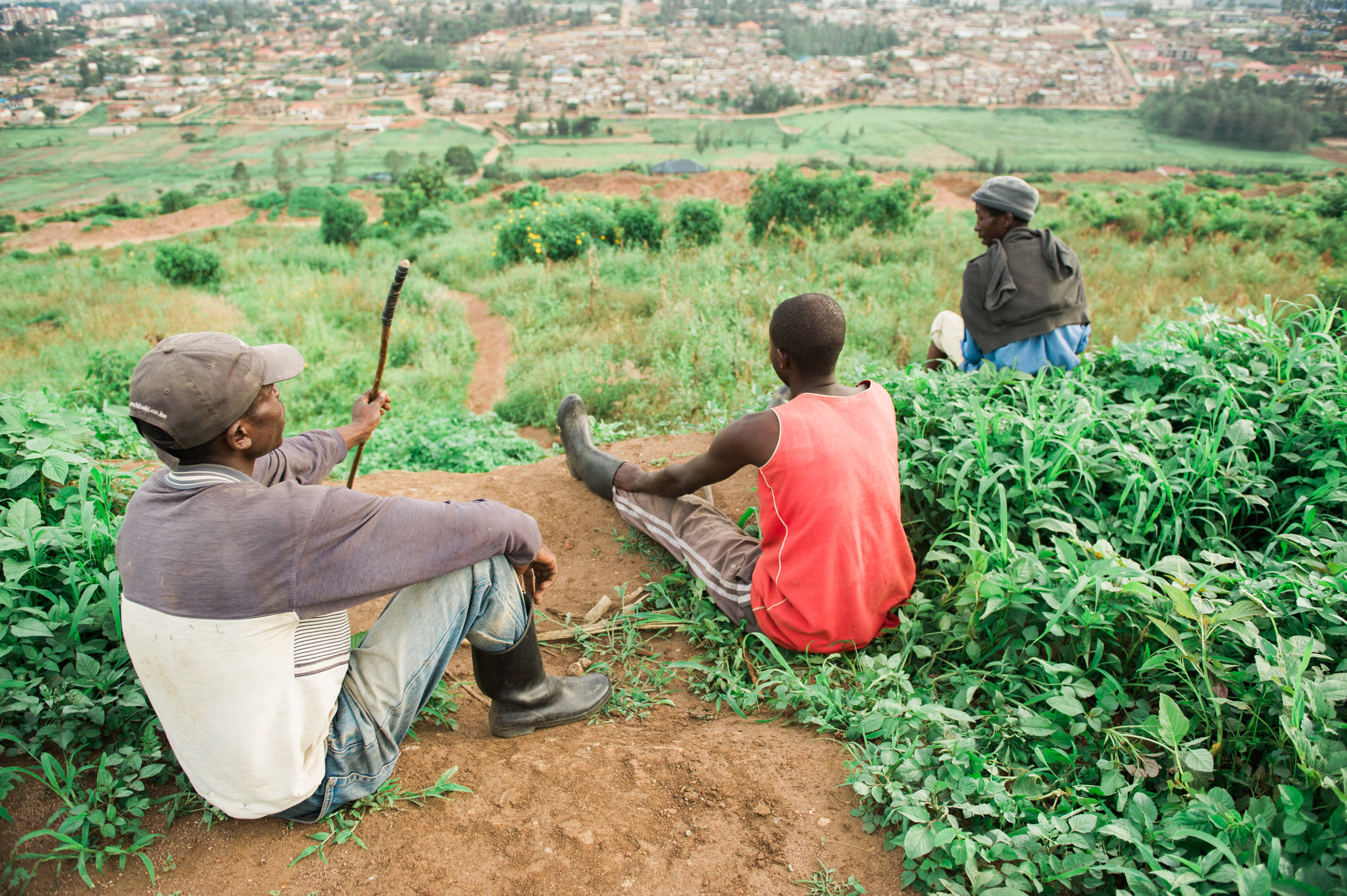  Farmers in a valley between two of Kigali's five major hills. 