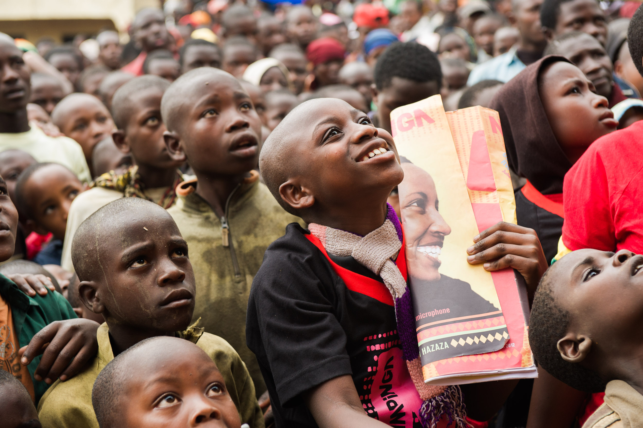 Girls look up at the stage during the distribution of Nike Foundation's magazine Ni Nyampinga, a part of the country's first girls' movement called the Girl Effect.&nbsp; 