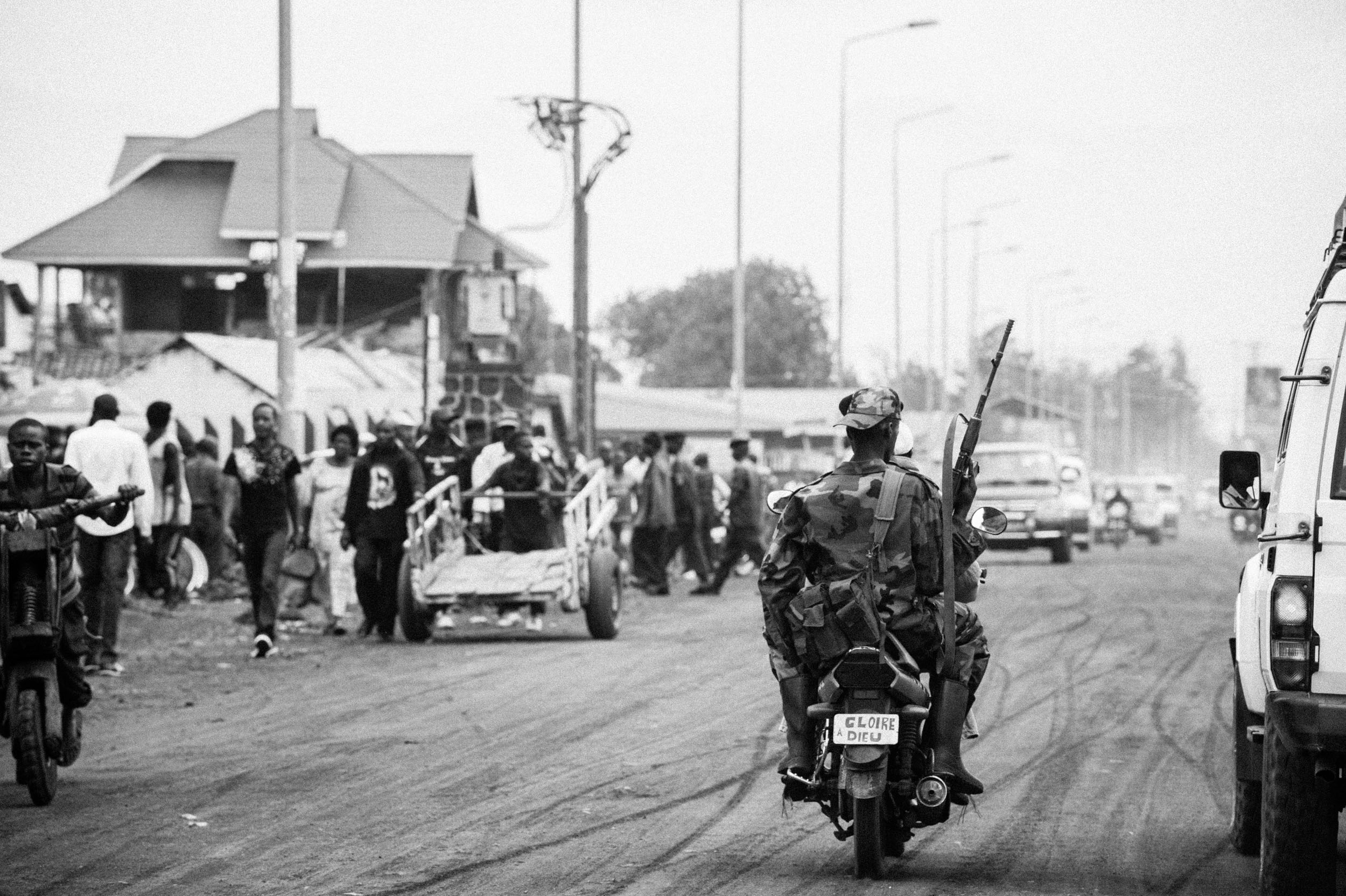  An M23 rebel rides a ‘moto-polo’ in the captured town of Goma, DRC. 