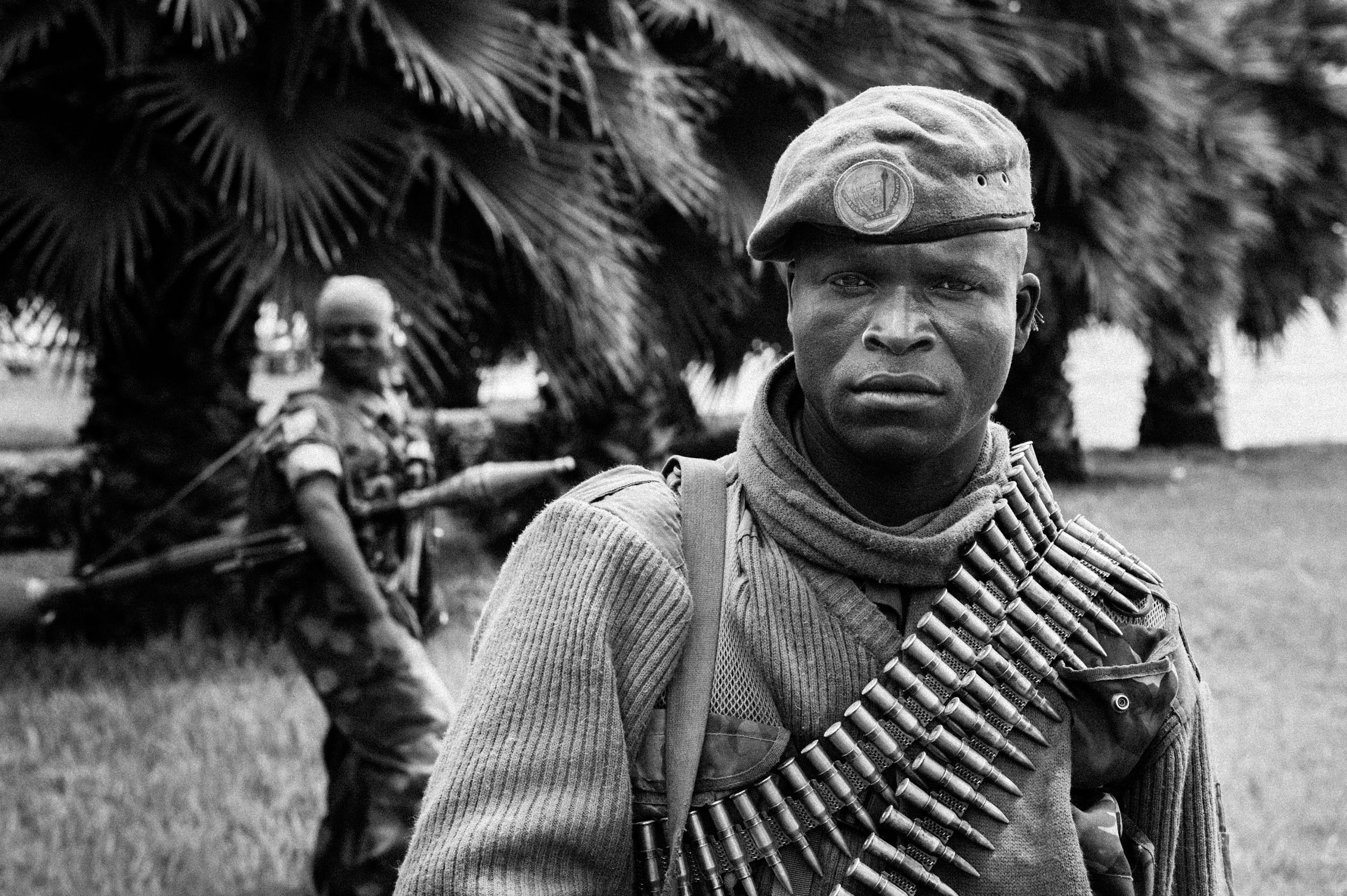  A soldier of the Armed Forces of the Democratic Republic of the Congo near a house on the shores of Lake Kivu used as a command post for the treated army. 