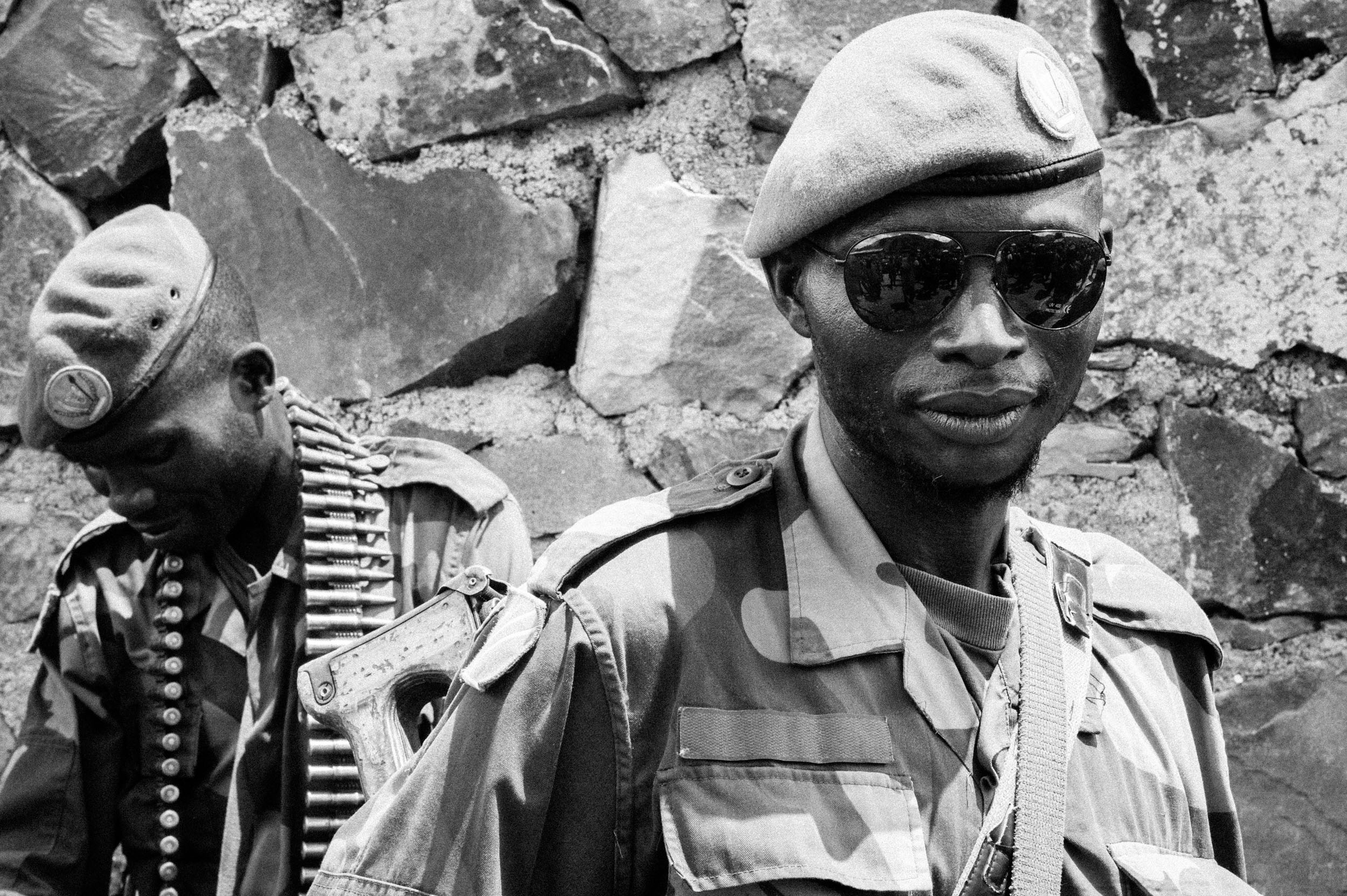  A soldier of the Armed Forces of the Democratic Republic of the Congo near a house on the shores of Lake Kivu used as a command post for the treated army. 