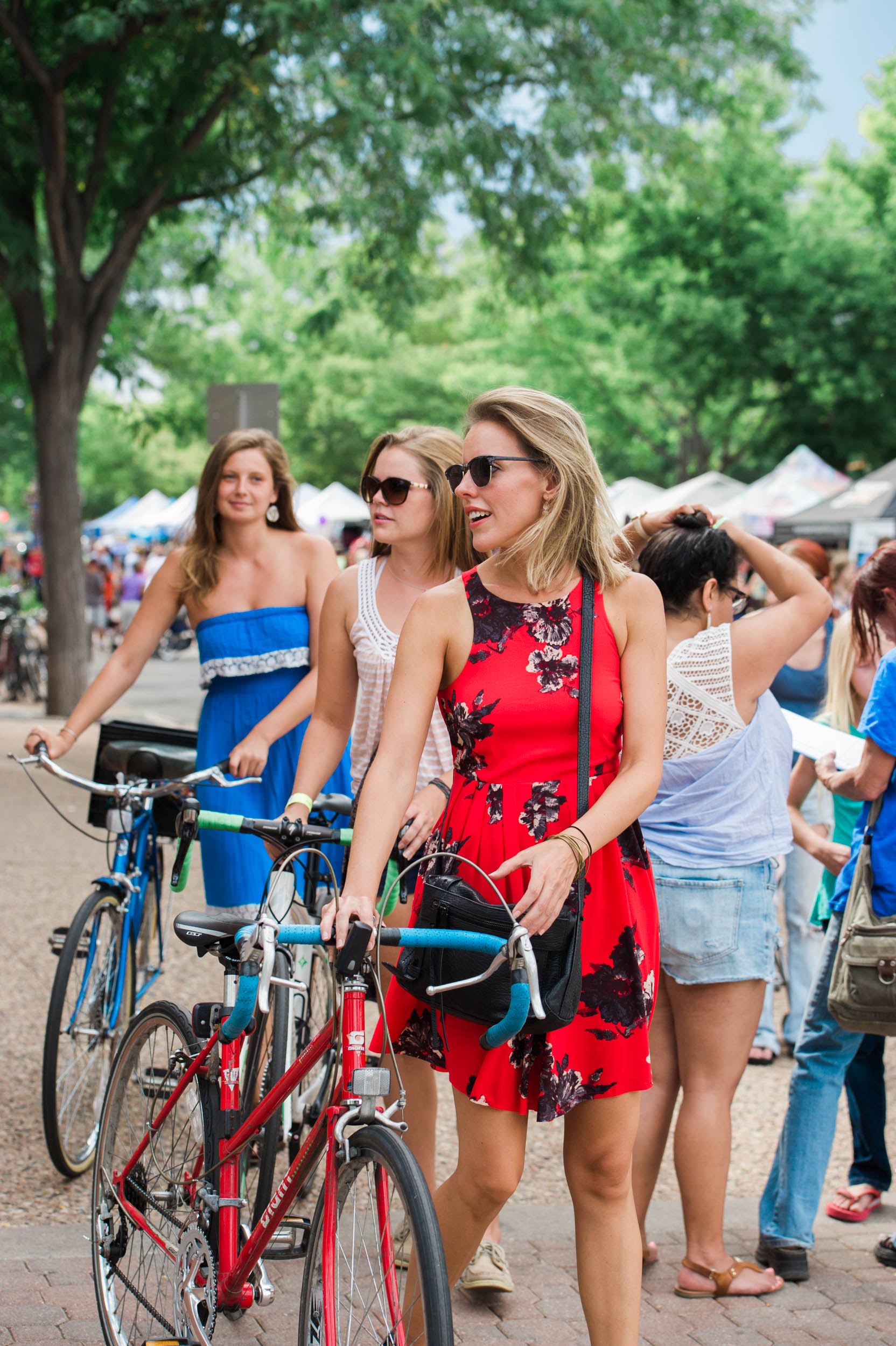  Young women arrive at New West Fest, a music festival in downtown Fort Collins, Colorado 