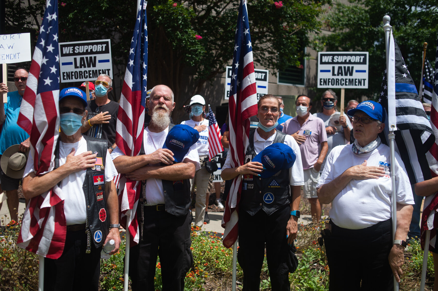  Members of the American Honor Guards of North Carolina, a veteran group, say the pledge of allegiance during a ‘Back the Blue’ protest in July 2020. (Port City Daily photo/Mark Darrough) 