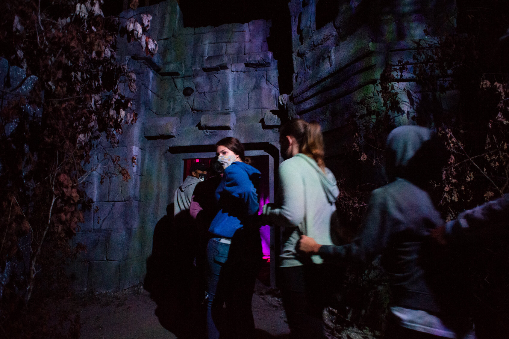  A group of girls hold on to each other as they enter a haunted castle at the Panic Attack haunted house in southern Columbus County. (Read the story   here  .) 
