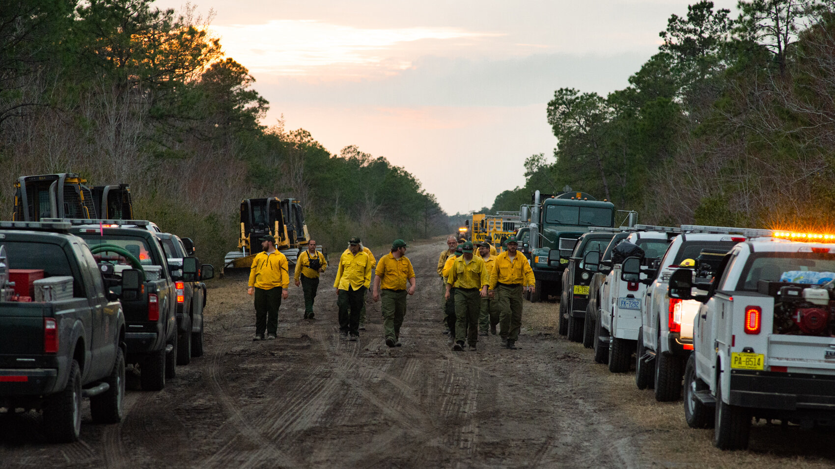  An N.C. Forest Service wildfire response crew calls it a day after fighting to control the spread of a wildfire on Friday inside the Holly Shelter Game Land on Friday. It began as a controlled burn on Monday before it broke out into an uncontrolled 