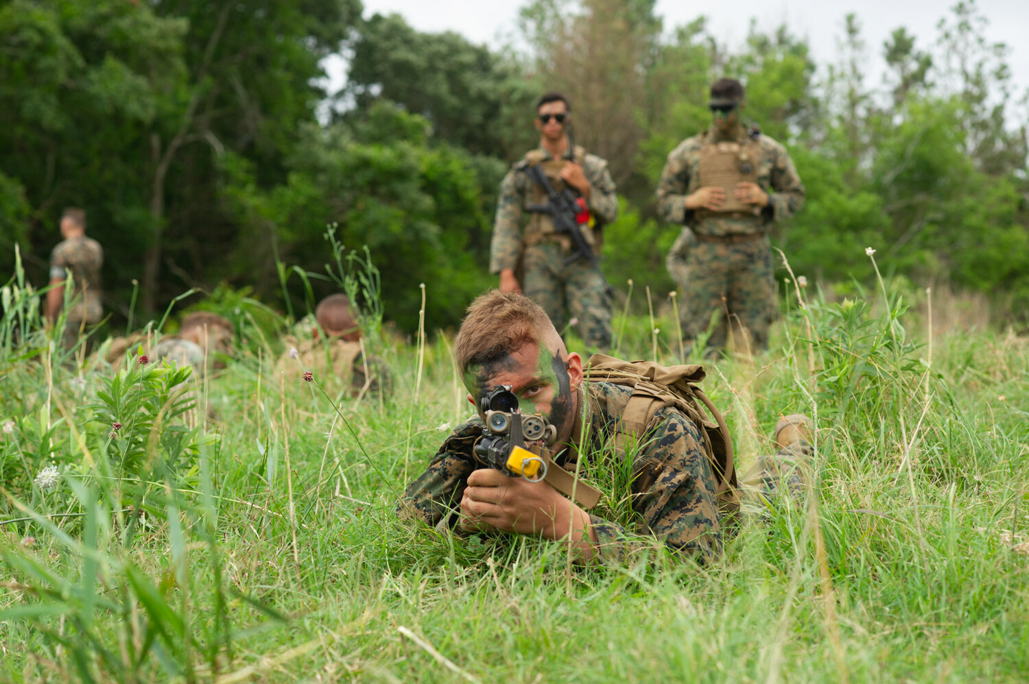  While waiting for sky visibility to improve for the aerial assault, Marines conducted machine gun exercises in a grassy field next to the Bogue Airfield landing strip. Nearly 500 Marines took part in what Lieutenant Colonel Darrel Ayers called the l