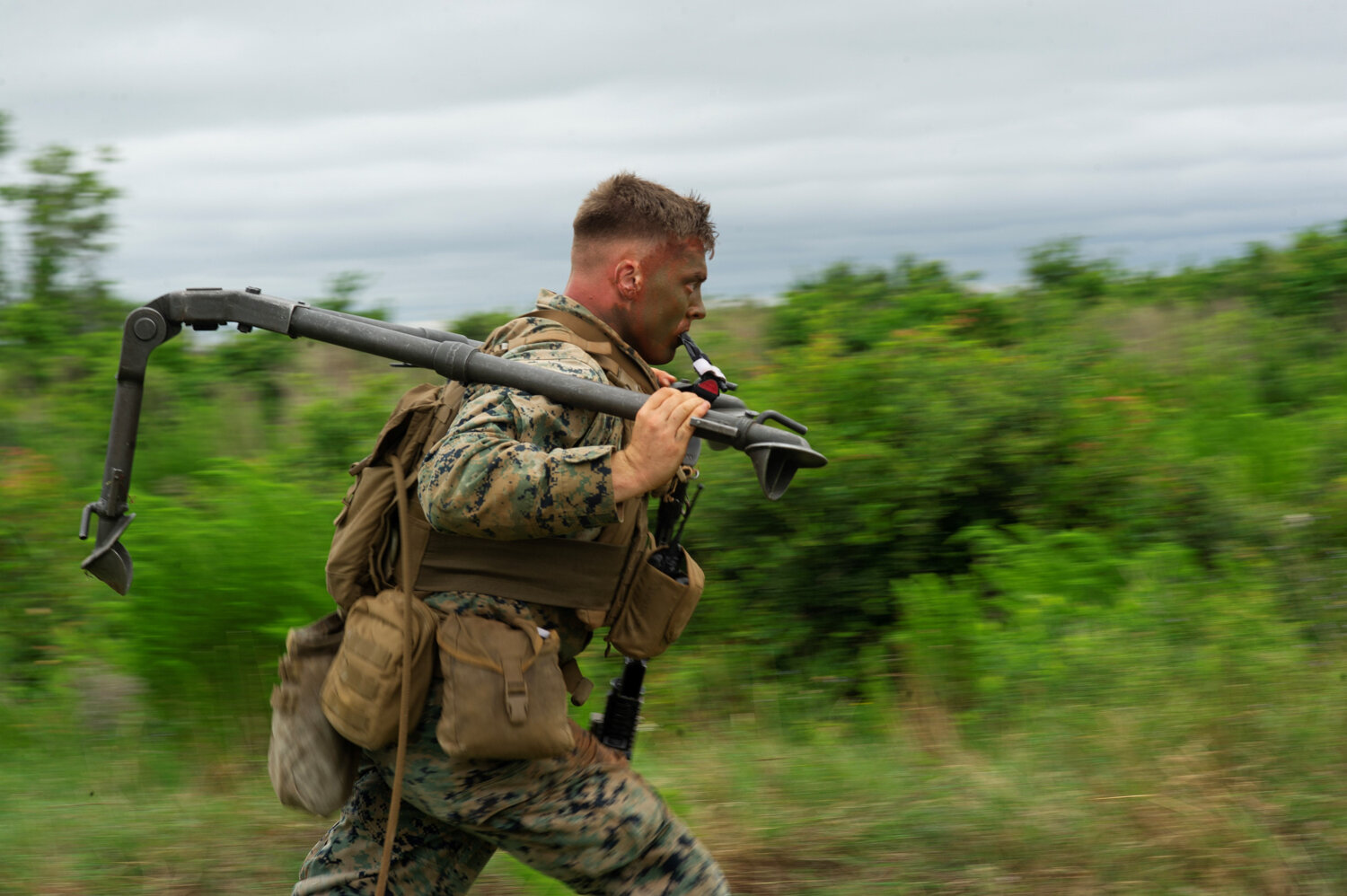  While waiting for sky visibility to improve for the aerial assault, Marines conducted machine gun exercises in a grassy field next to the Bogue Airfield landing strip. Nearly 500 Marines took part in what Lieutenant Colonel Darrel Ayers called the l