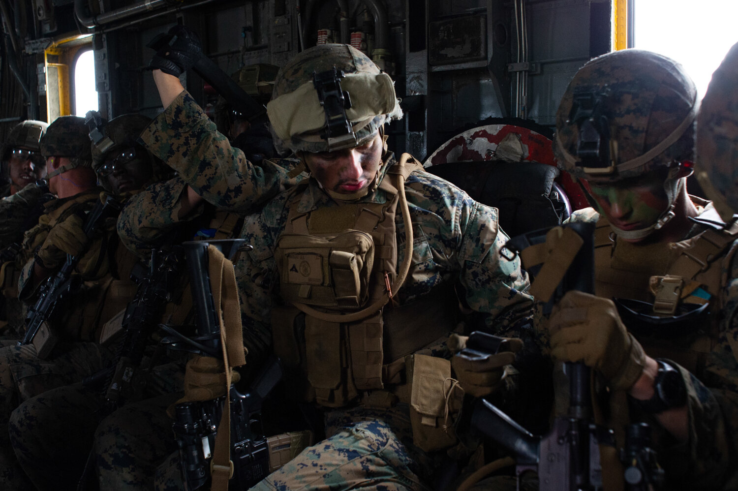  Marines aboard a CH-53 heavy lift helicopter as it flies south toward Davis Airfield, where the ‘assault’ will soon take place. Nearly 500 Marines took part in what Lieutenant Colonel Darrel Ayers called the largest air assault exercise on the east 