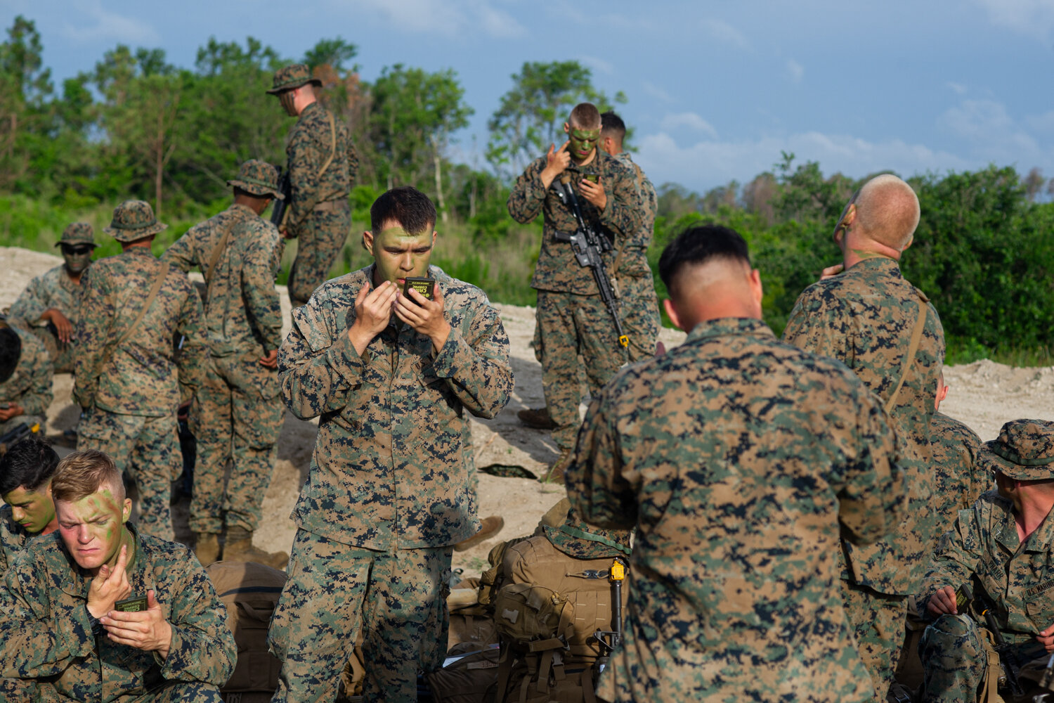  Marines apply camouflage before the assault exercise begins. Nearly 500 Marines took part in what Lieutenant Colonel Darrel Ayers called the largest air assault exercise on the east coast in approximately 10 years.  (See the award-winning photo essa