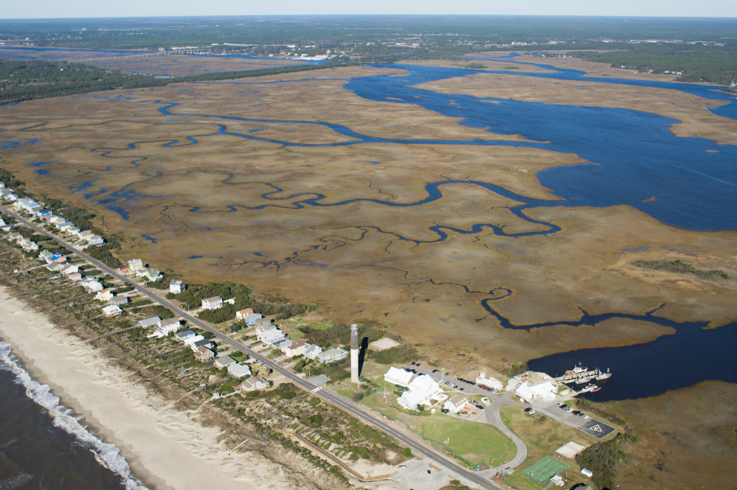  The Oak Island Lighthouse with Molasses, Coward, and Boathouse creeks to the north. (See the photo essay   here  .) 