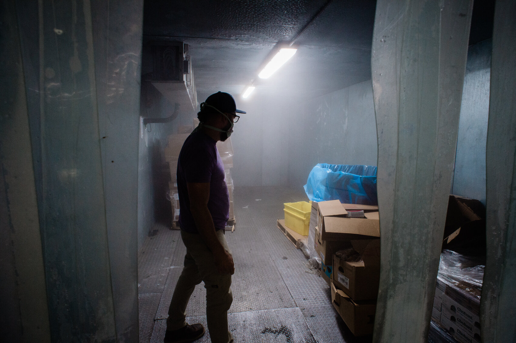  Greg Casaletto inside one of the freezers at the Food Bank’s distribution facility in Wilmington. “Before [the Covid-19 pandemic], we’d get 800 pounds of meat from grocery stores [per day]. After this started, we get maybe 250 to 300 pounds, some da