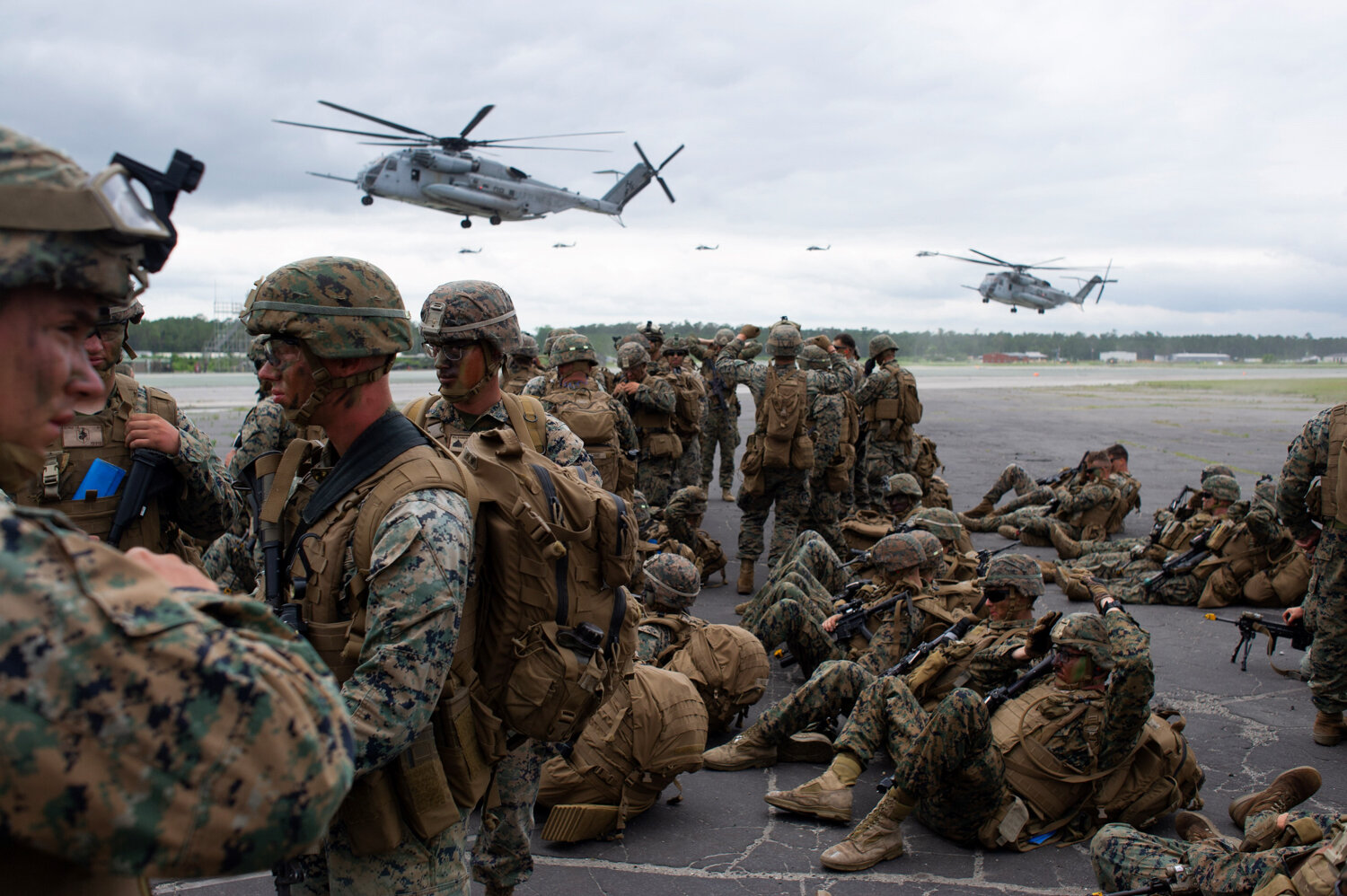  U.S. Marines of the 2nd Marine Division wait to board CH-53 Stallion and MV-22 Osprey helicopters as part of what Lieutenant Colonel Darrel Ayers called the largest air assault exercise on the east coast in approximately 10 years, June 13, 2019. 