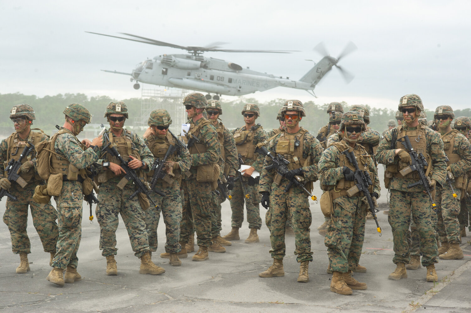  U.S. Marines of the 2nd Marine Division wait to board CH-53 Stallion and MV-22 Osprey helicopters as part of what Lieutenant Colonel Darrel Ayers called the largest air assault exercise on the east coast in approximately 10 years, June 13, 2019. 