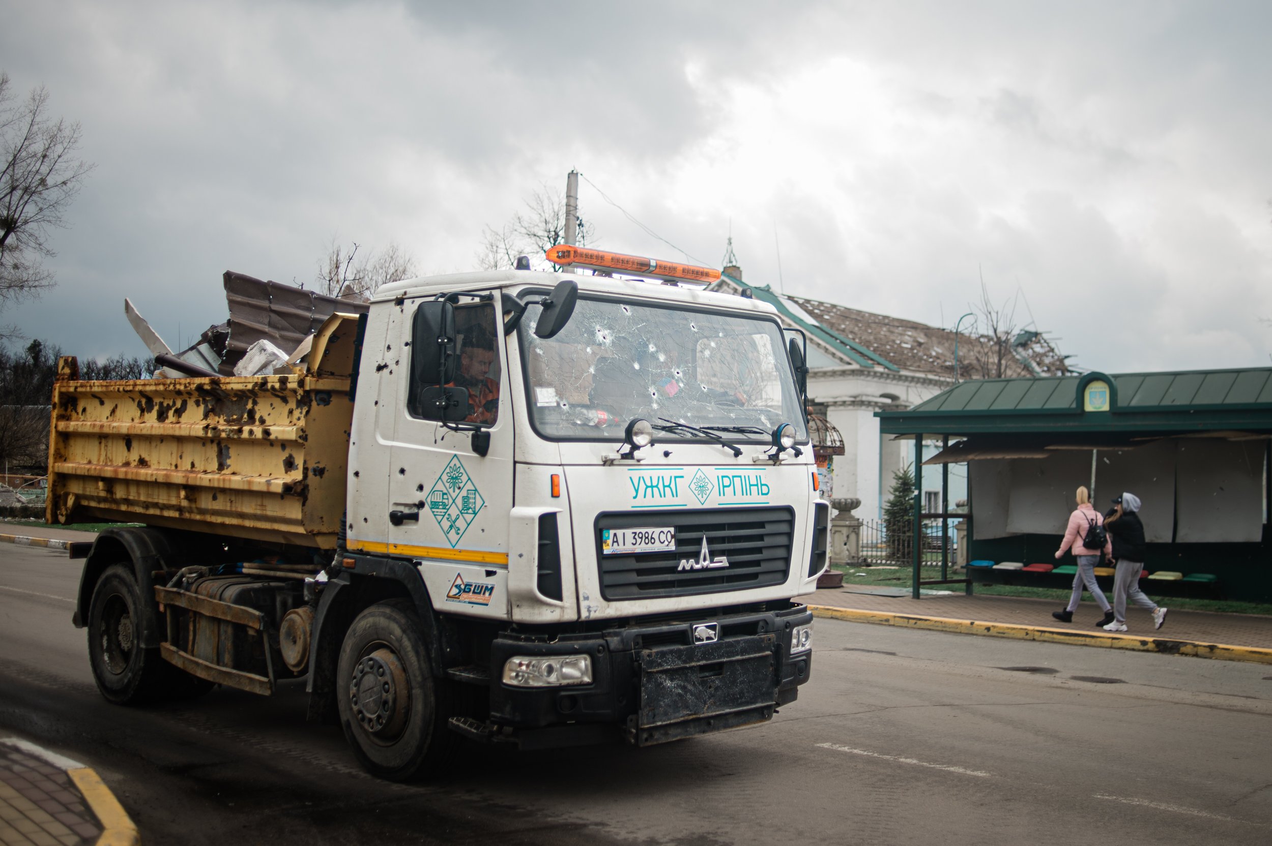  A bullet-riddled truck transports debris through the Kyiv suburb of Irpin. 