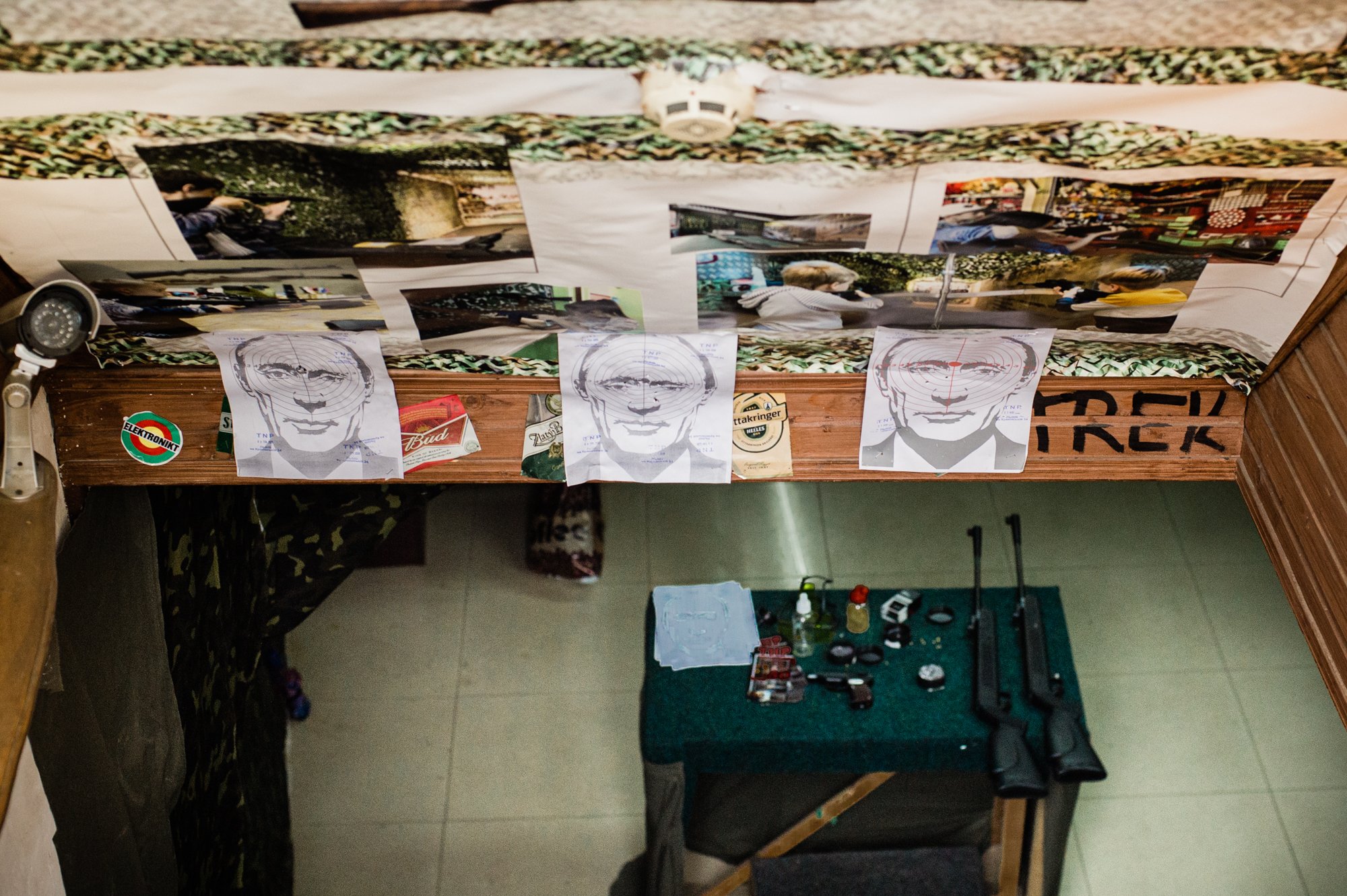  Targets targets printed on drawings of Russian President Vladimir Putin hang above the entrance of a gun store in Lviv in western Ukraine. 