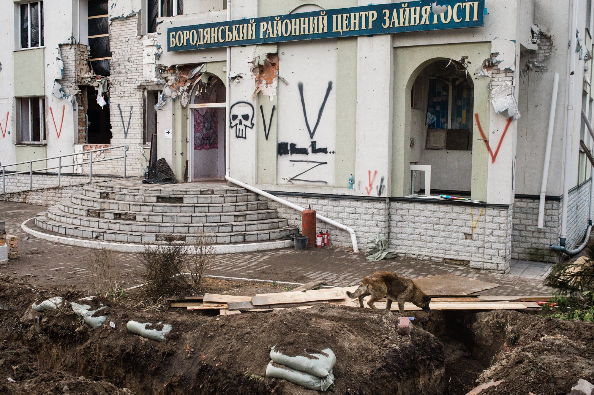  Trenches surround a building in the Kyiv suburb of Irpin defaced with graffiti by Russian soldiers, according to locals. The Russian Ministry of Defence said in early March, when Russian troops were retreating the region, that the “Z” symbol stands 