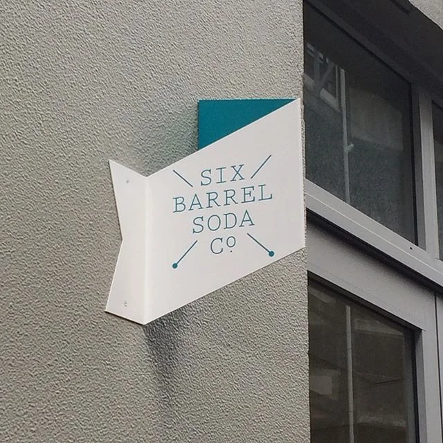 Six Barrel Soda Pals since the 90s, Joe & Mike have shared years of questionable fashion choices and ridiculous business plans. After some dodgy batches and accidental fermentation we perfected our syrups for cocktails and sodas in our Wellington dive bar and in 2012 we started Six Barrel Soda Co. with a lofty mission to shake up a flat soft drink market with experimental flavours and a new level of quality. We fired up a 10L pot and used a beat-up soda stream to make drinks in our soda store to show what we believe soda can be. Our early brave customers liked it and now our soda syrups and bottled sodas are now being used to make wonderful drinks all over the place by the best soda jerks, the most creative cafes, restaurants and bars and home soda fans looking for something different. Soft drinks need to change, so we're changing them.