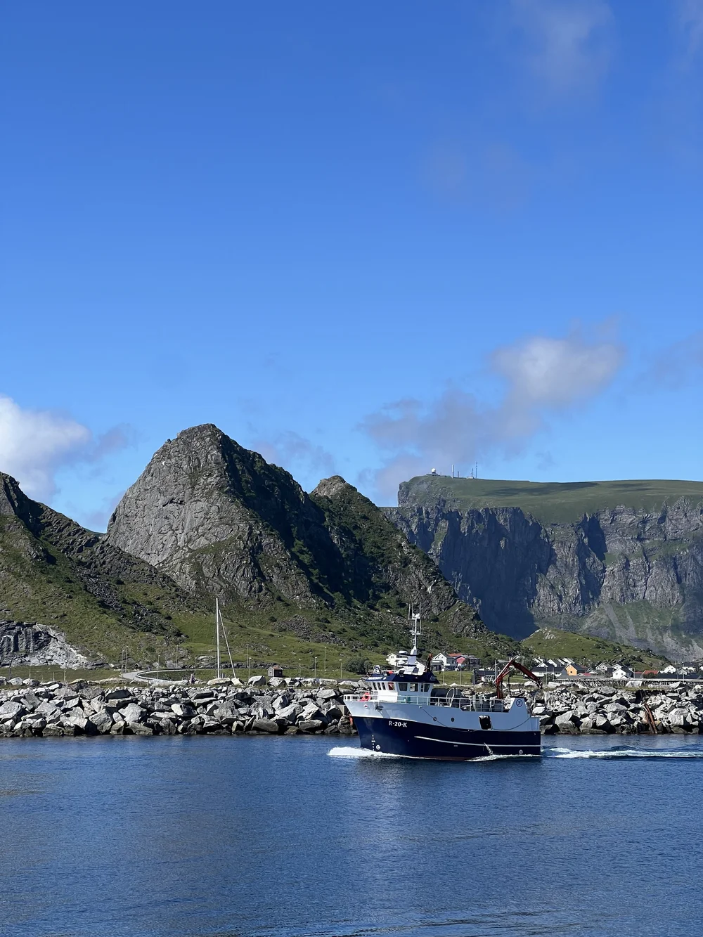 One of many fishing boats departing the harbor