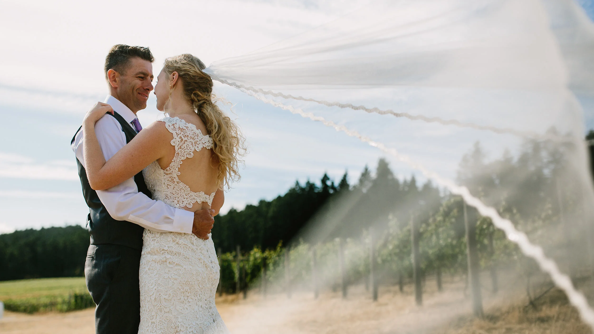 wedding photography Victoria BC Canada bride and groom wind summer sun